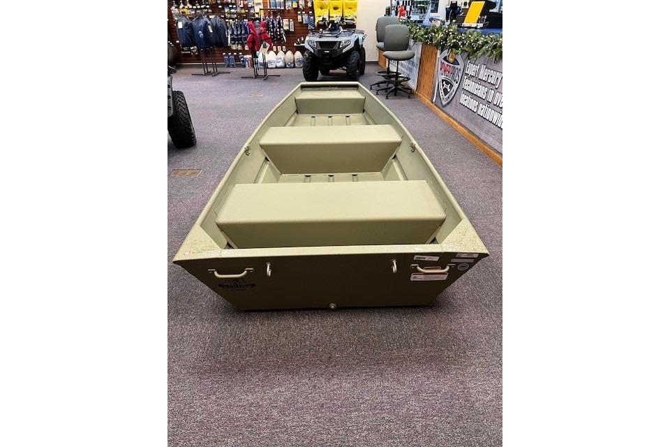 2025 Tracker Grizzly 12 Jon boat displayed indoors, featuring a simple, sturdy design.