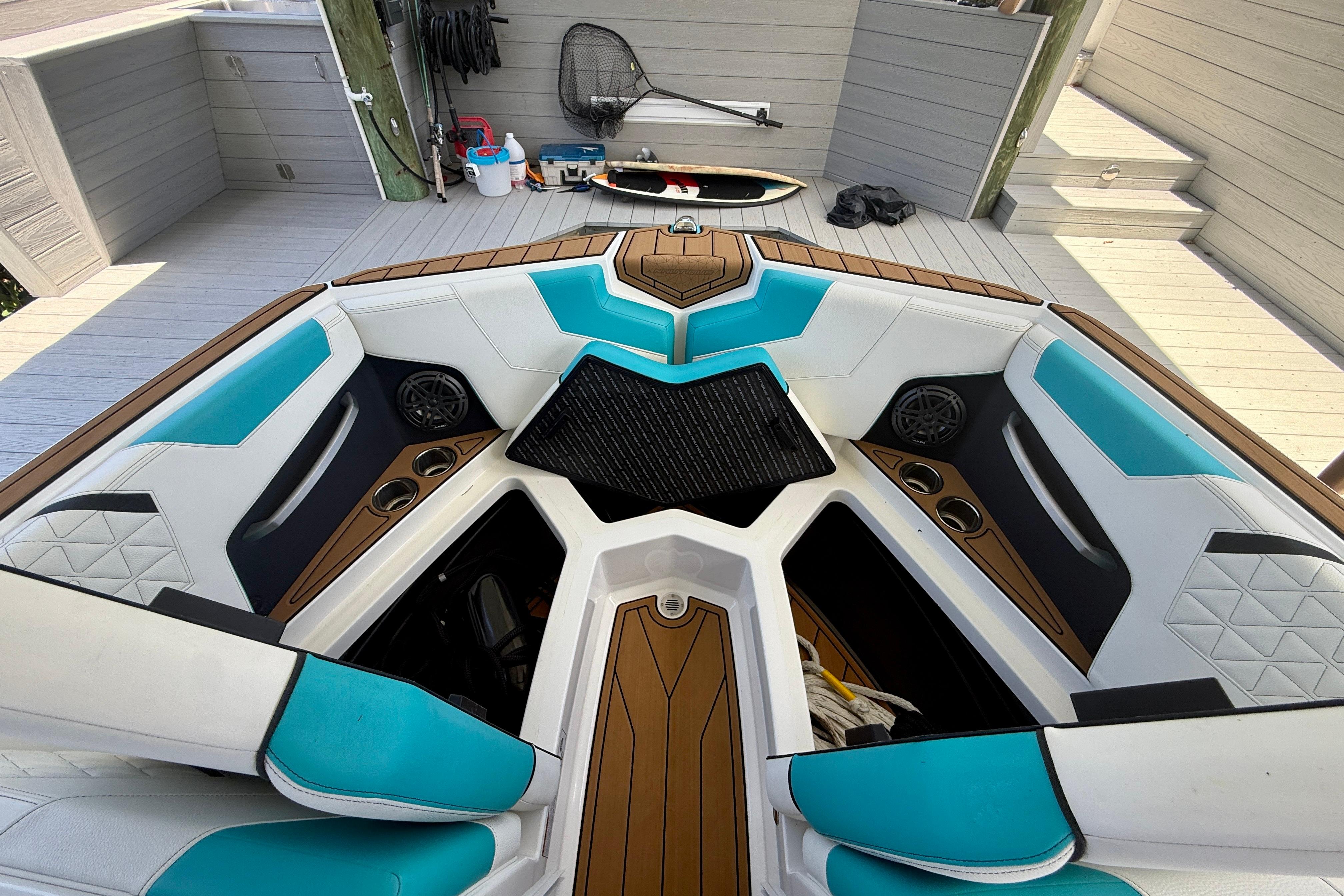 2024 Nautique Super Air Nautique GS20 boat interior with teal and white seating.
