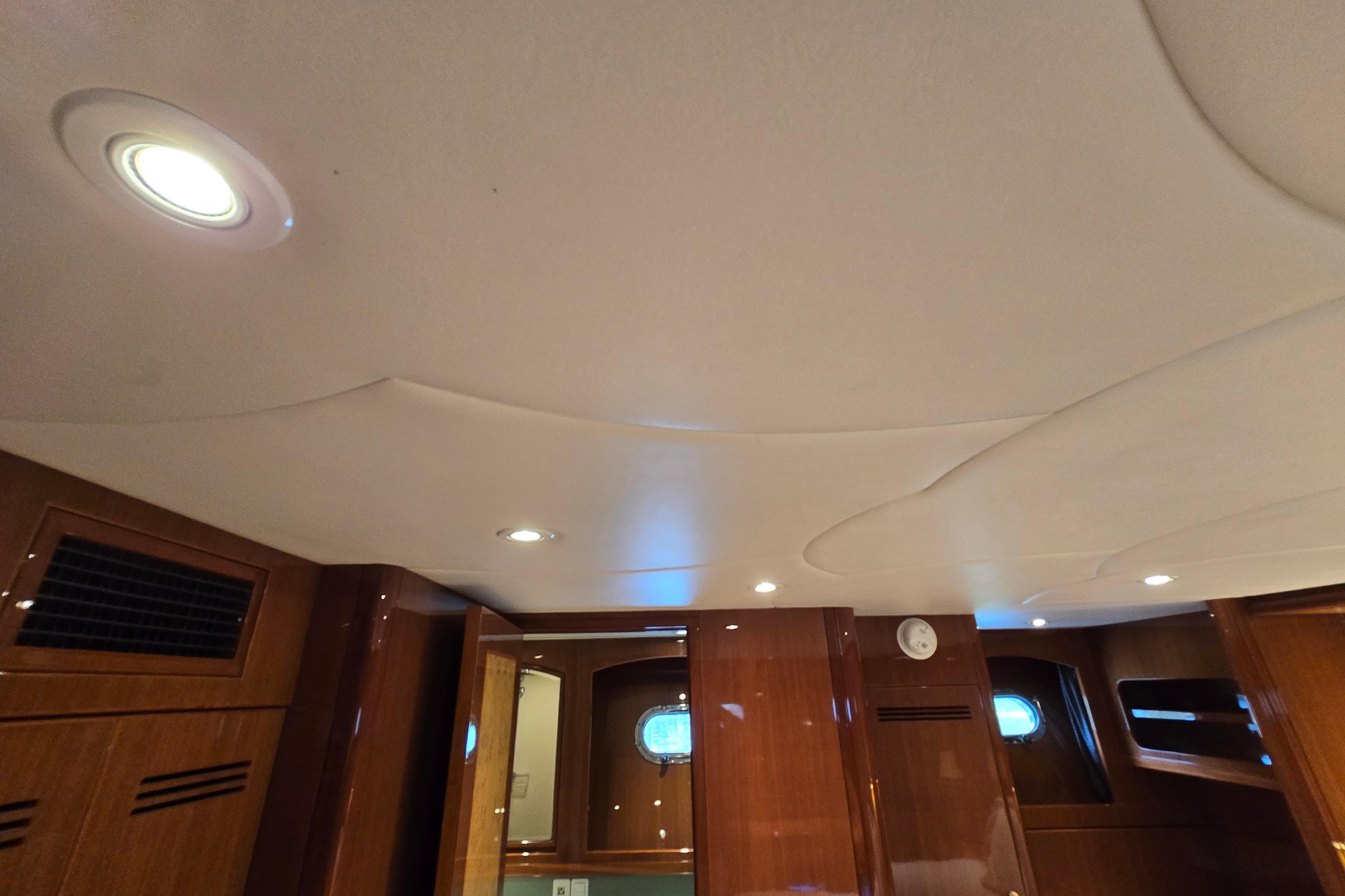 Interior of 2004 Grand Harbour 58 yacht with wooden paneling and recessed lighting.