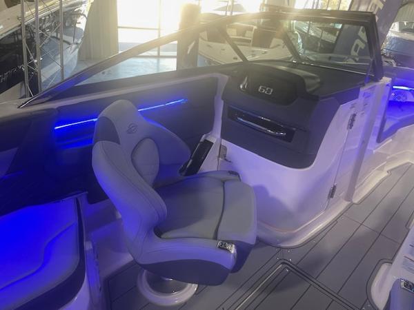 2025 Chaparral 267 SSX boat interior with modern seating and blue LED lighting.