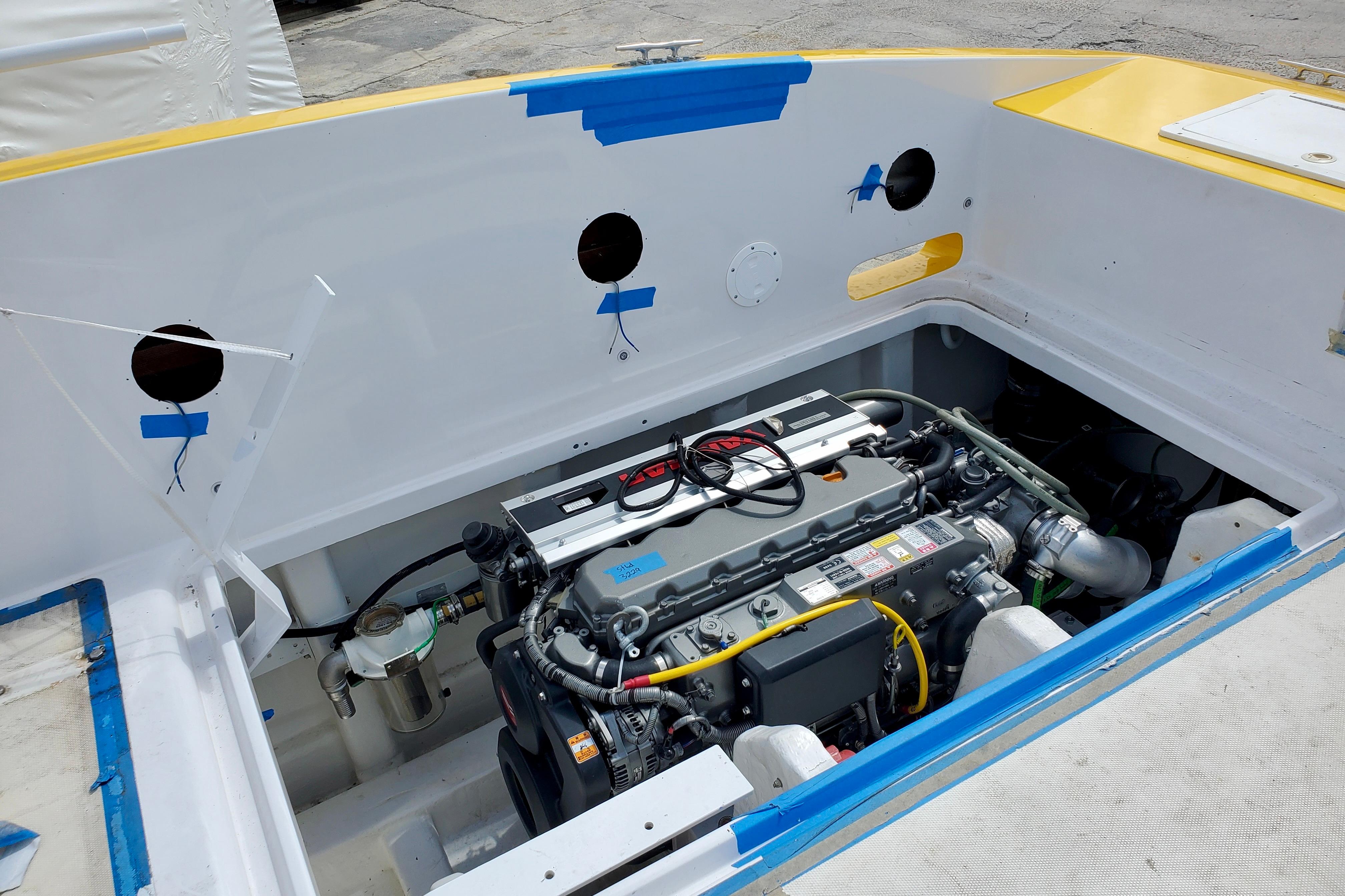 2005 Thriller Powerboats Super Cat 55 engine compartment, showcasing detailed mechanical components.