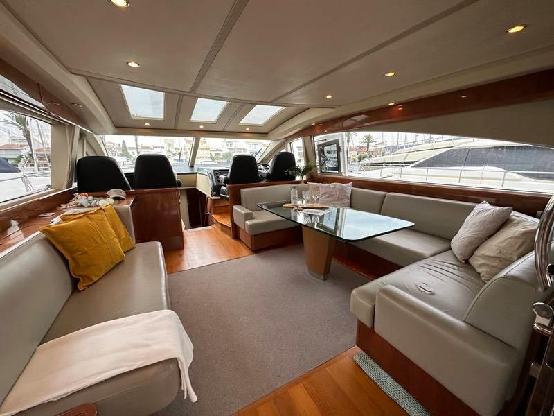 Luxurious 2007 Princess V70 yacht interior with spacious seating and elegant decor.
