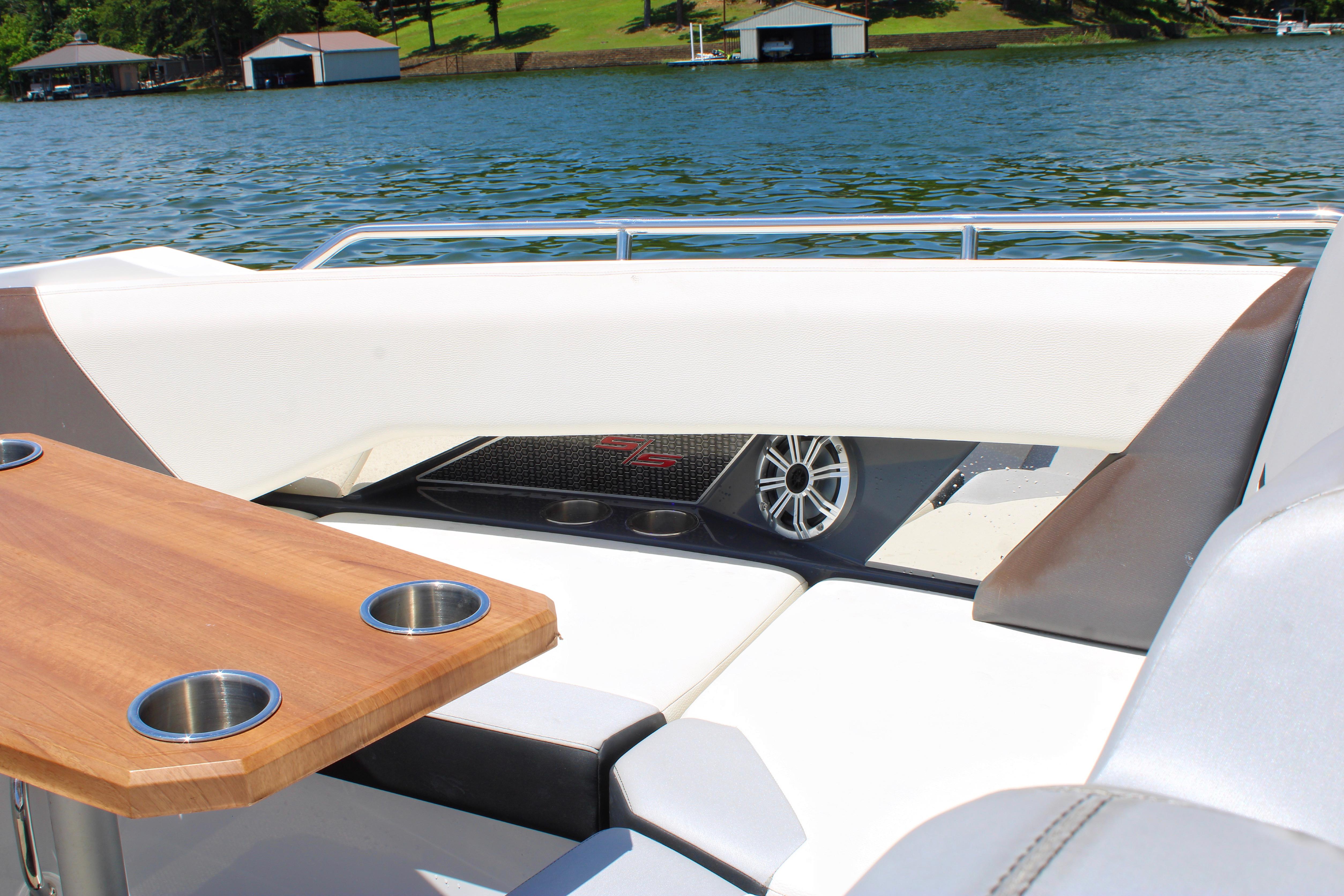 2017 Cruisers Yachts 338 Bow Rider interior with table and lake view.