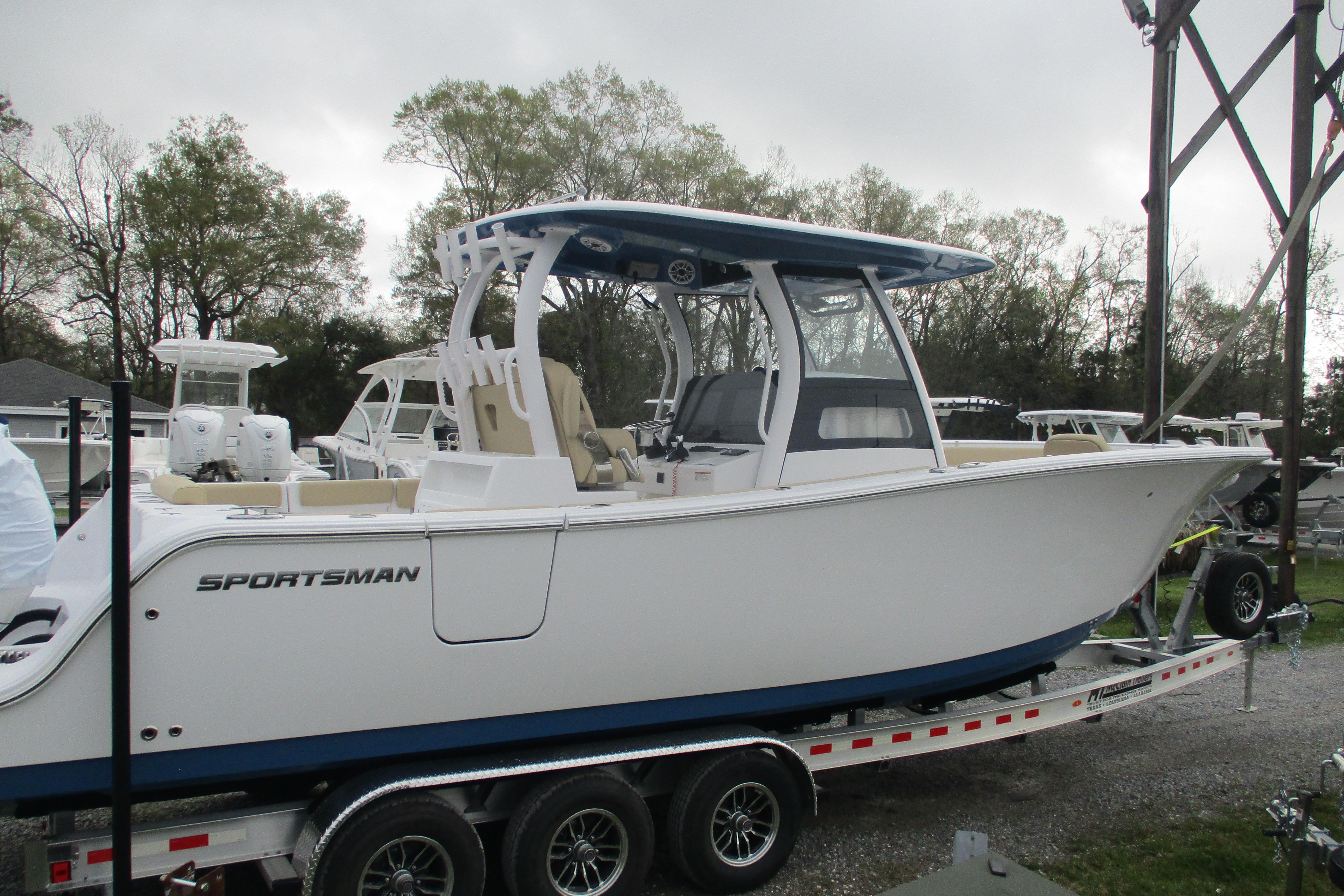 2026 Sportsman Open 302 Center Console boat on trailer, side view.