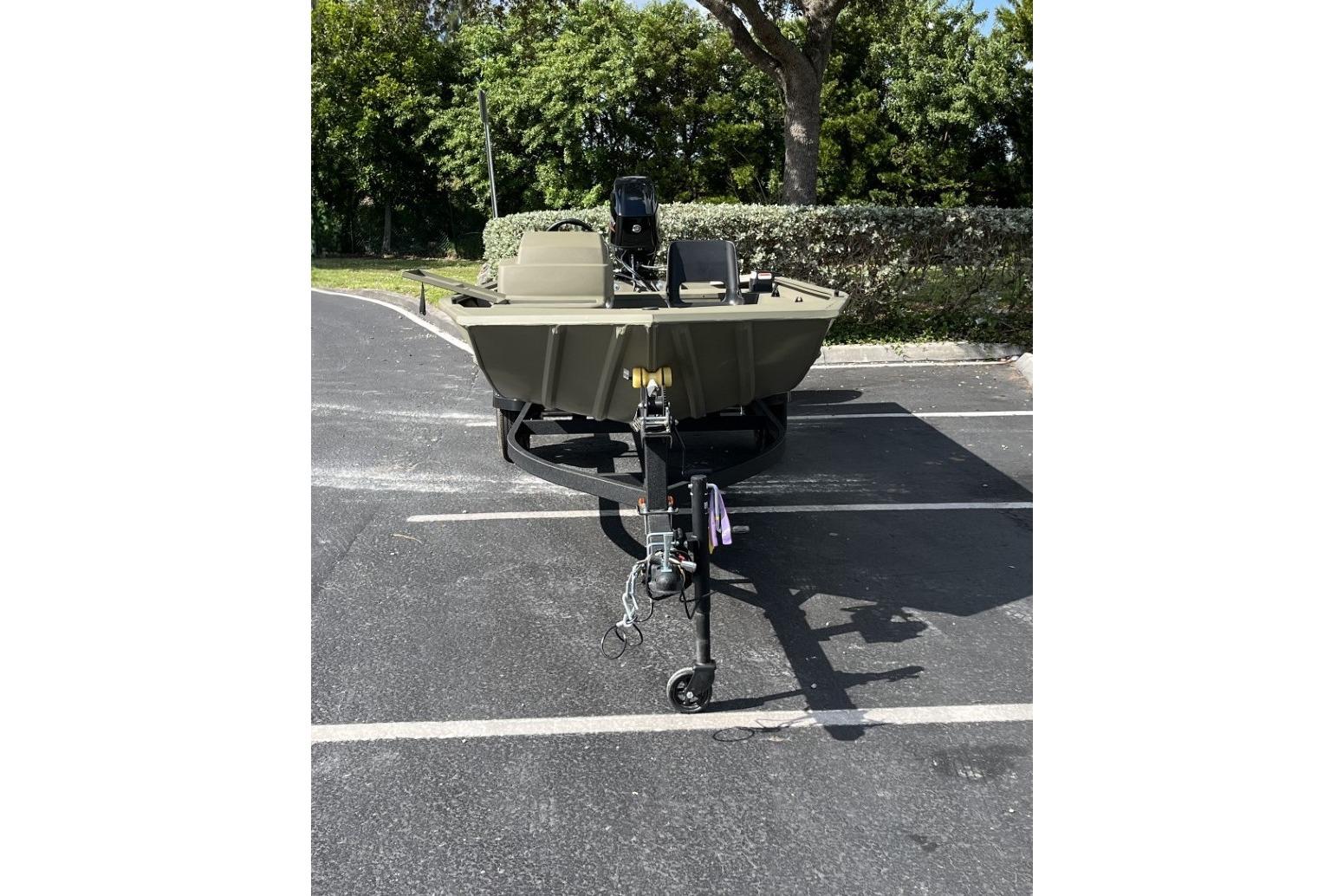 2026 Tracker Grizzly 1754 SC boat on trailer in parking lot.