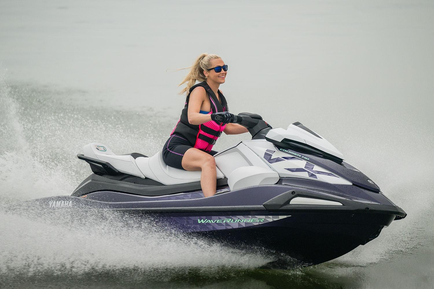 Manufacturer Provided Image: Woman riding 2026 Yamaha WaveRunner FX Cruiser SVHO on water, wearing a life vest and sunglasses.