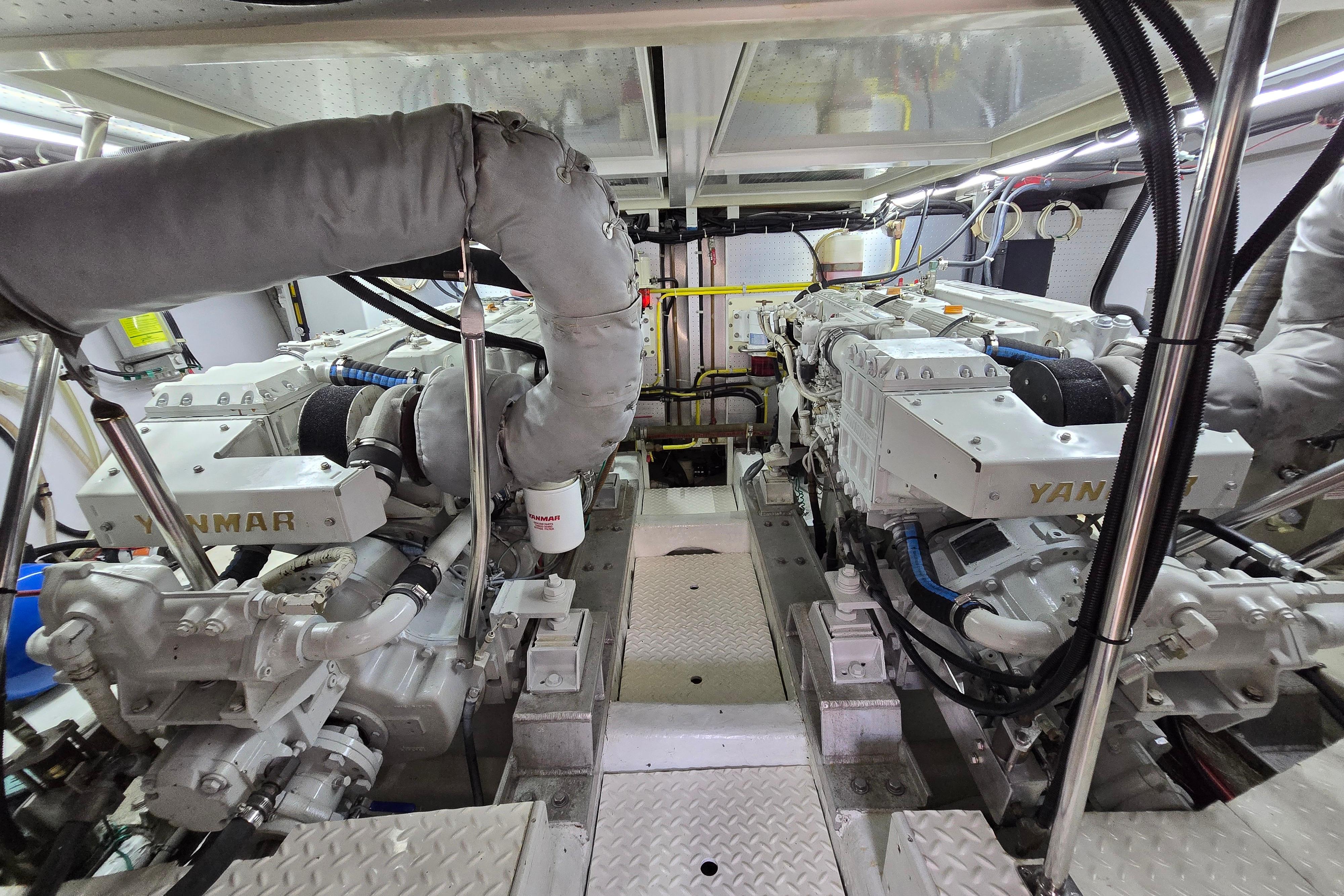 Engine room of a 2004 Grand Harbour 58 yacht featuring Yanmar engines.