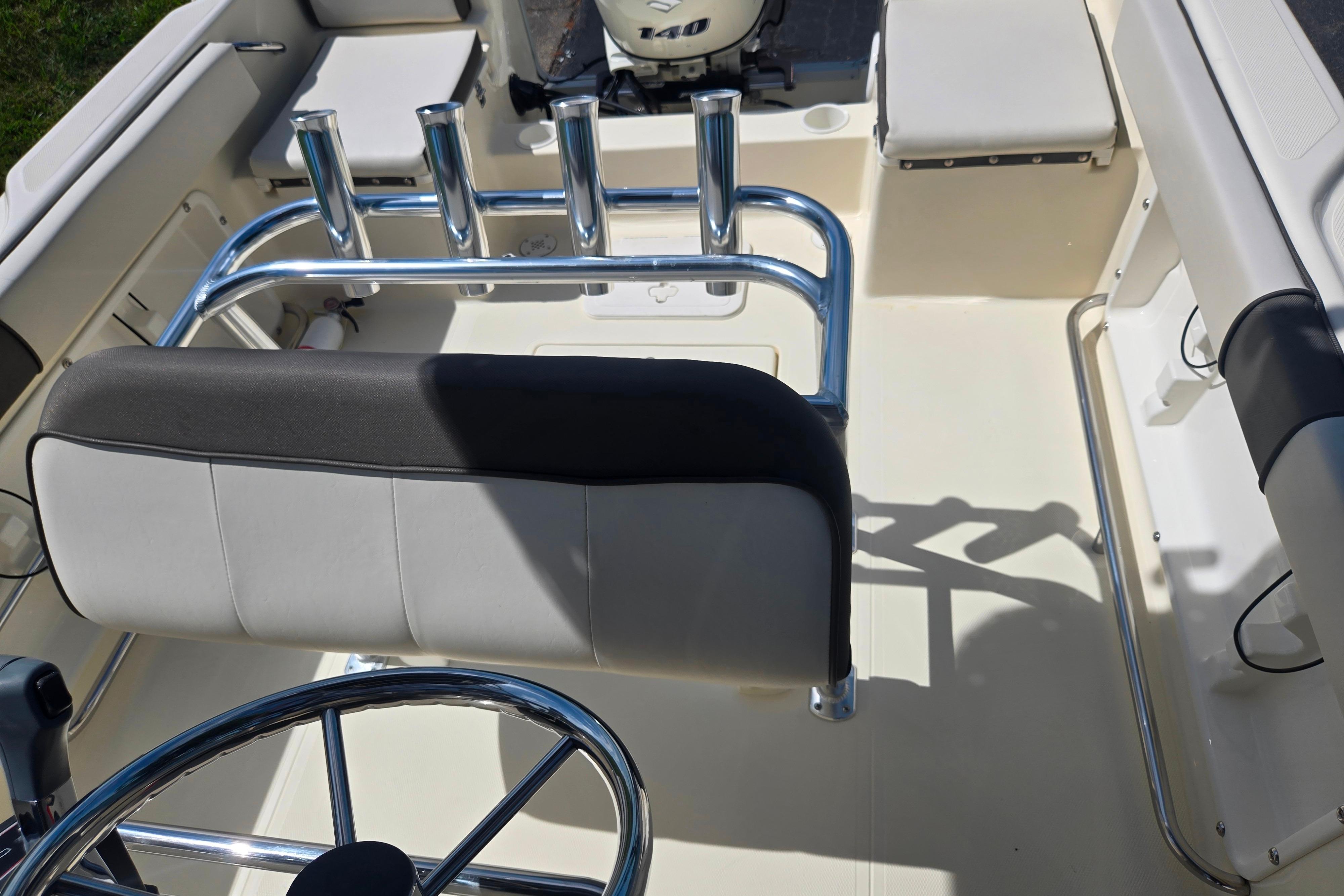 Interior of a 2016 Key Largo 2000CC boat with seating and rod holders.
