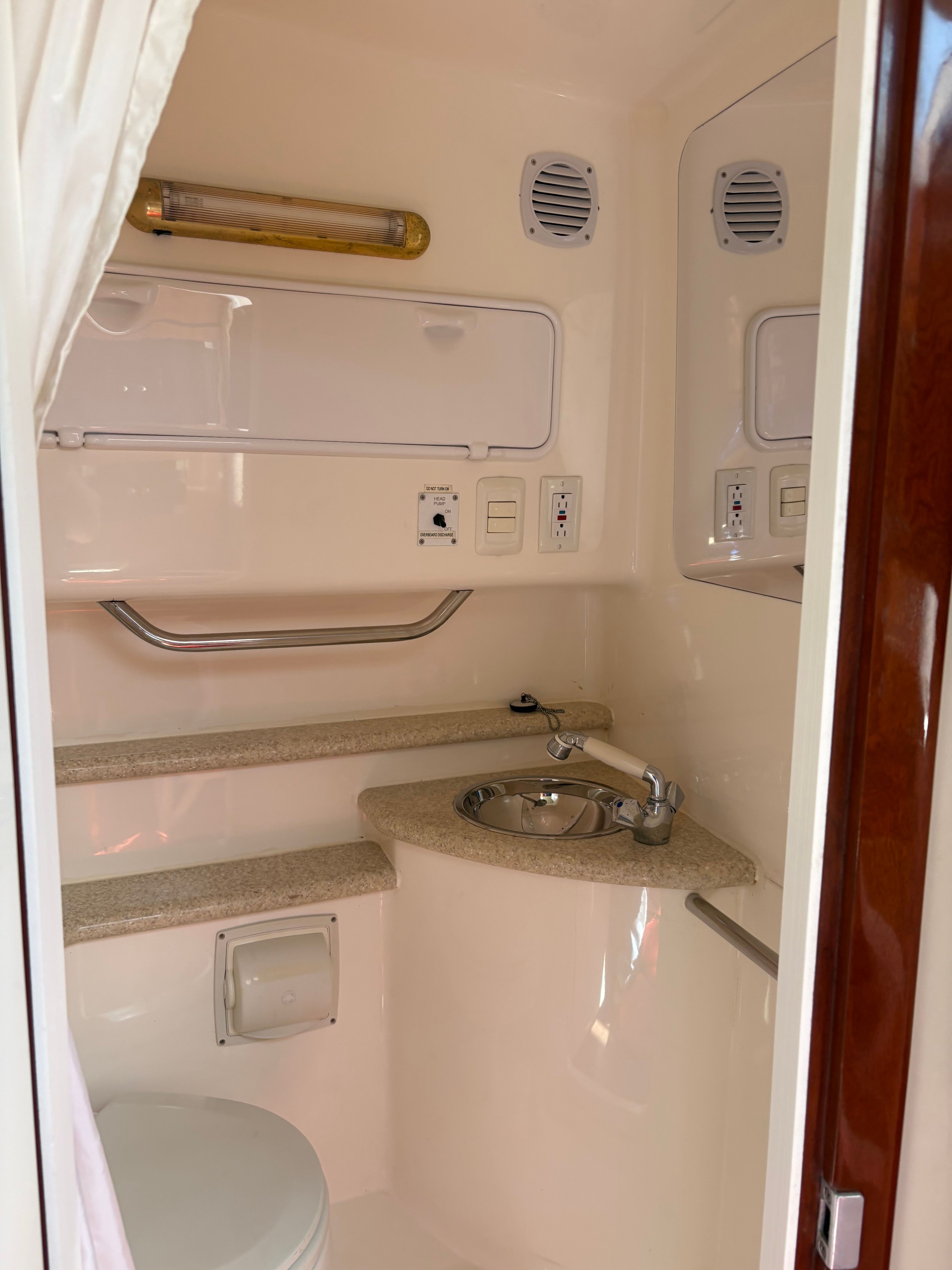 Interior of 2009 Fountain 33 Sportfish Cruiser with sink and toilet.
