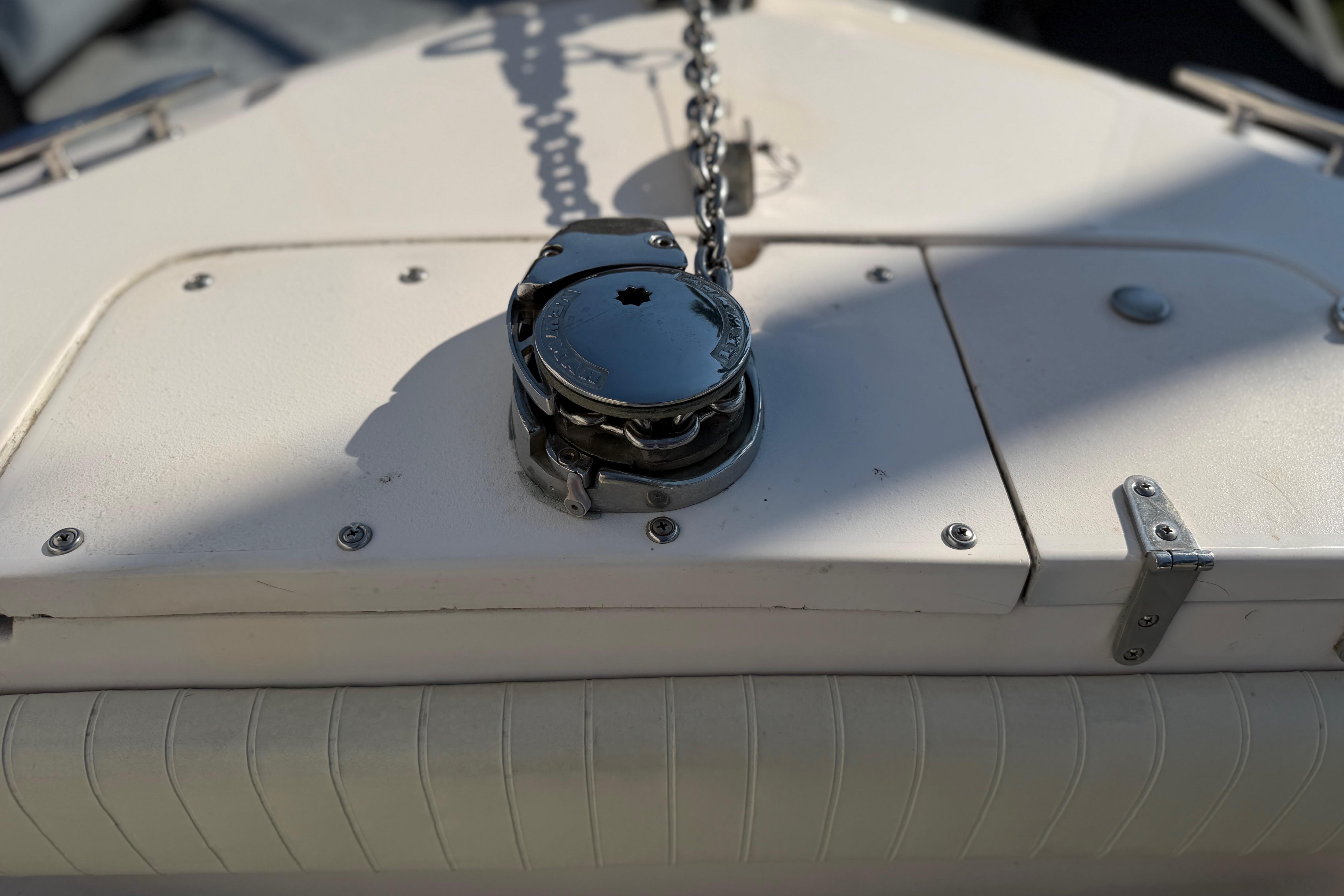 Anchor chain mechanism on 2004 Grady White 273 boat deck.