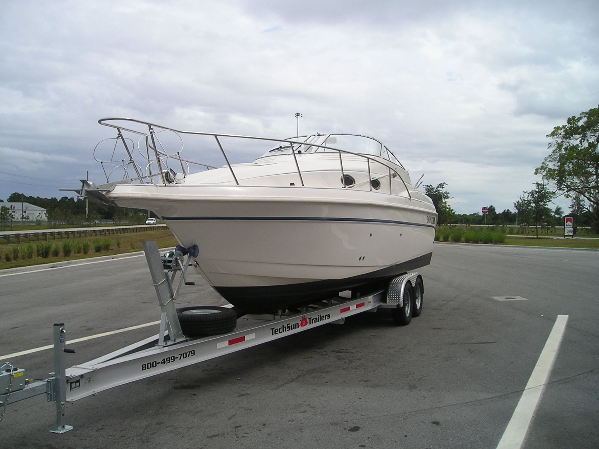 1997 Donzi 275LXC boat on trailer, side view.