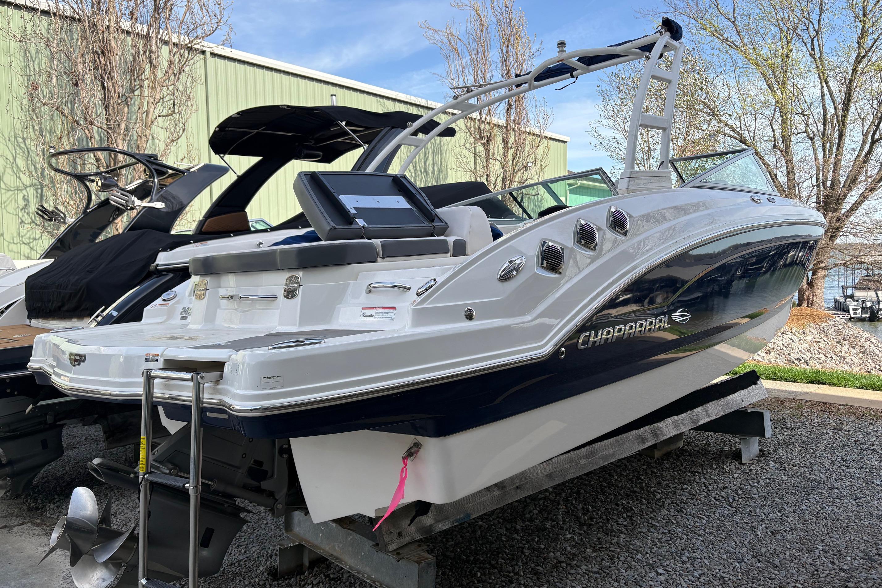 2016 Chaparral 246 SSi boat displayed outdoors on a stand.