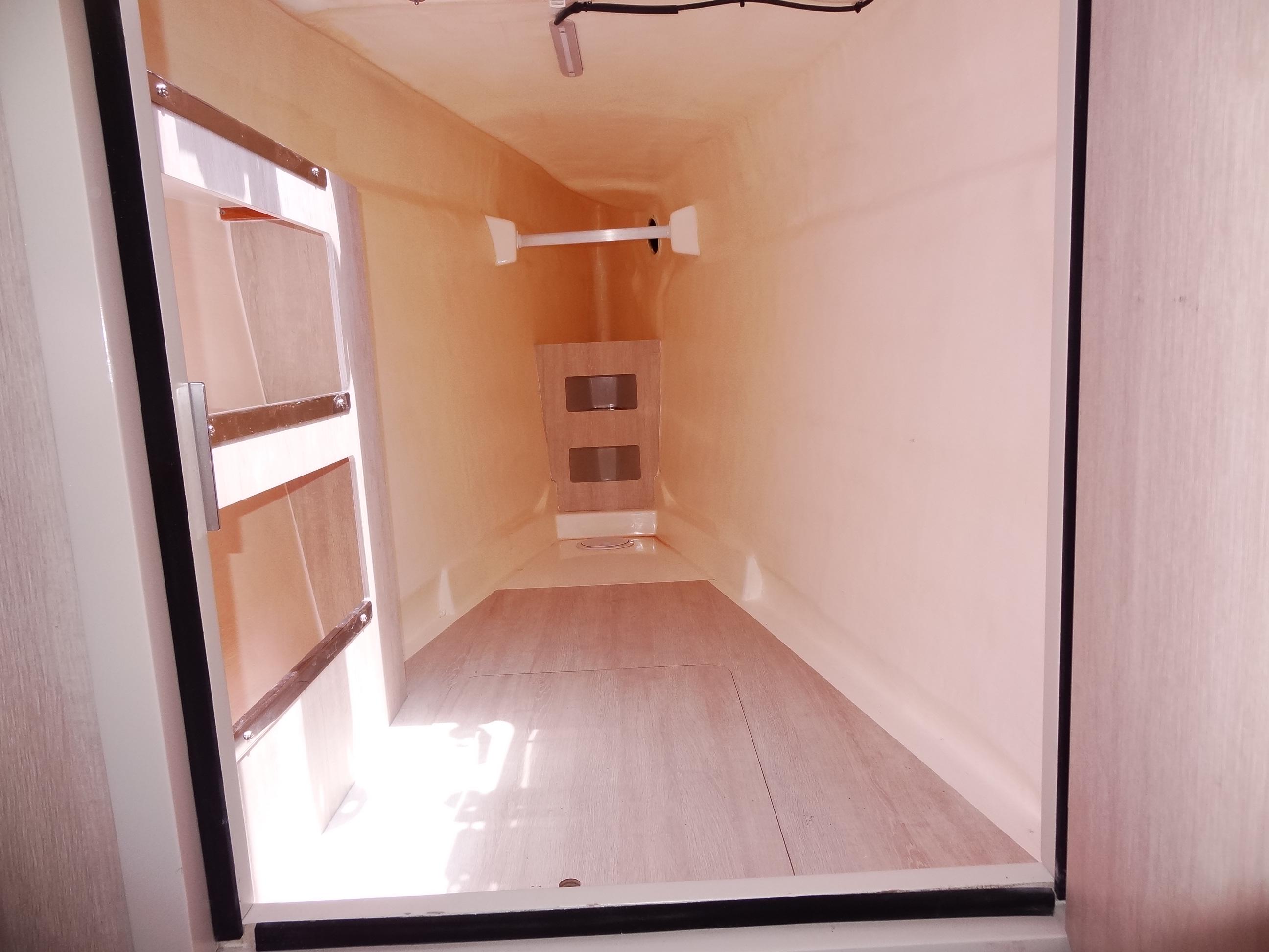Interior view of 2020 Leopard 51 Powercat storage compartment with ladder.