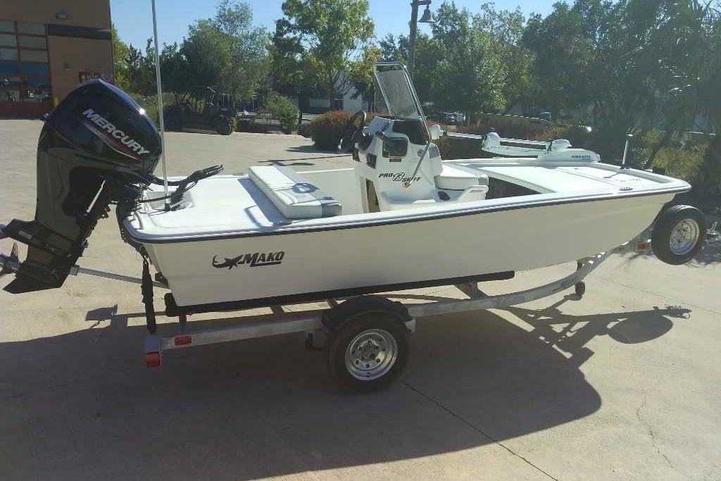 2026 Mako Pro Skiff 13 CC boat on trailer, featuring Mercury outboard motor.