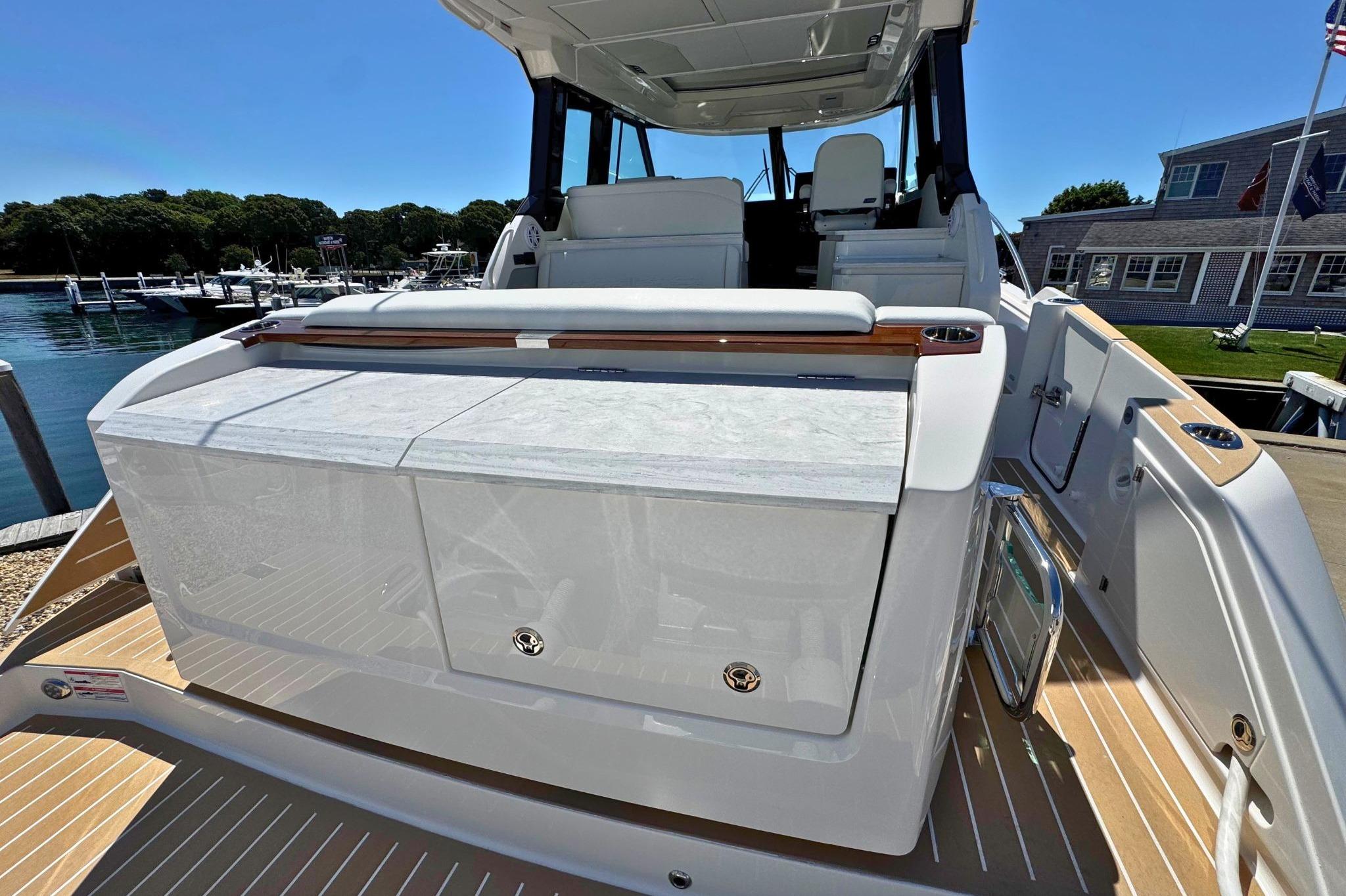 2027 Tiara Yachts 39 LE luxury yacht at dock, showcasing sleek design and spacious deck.