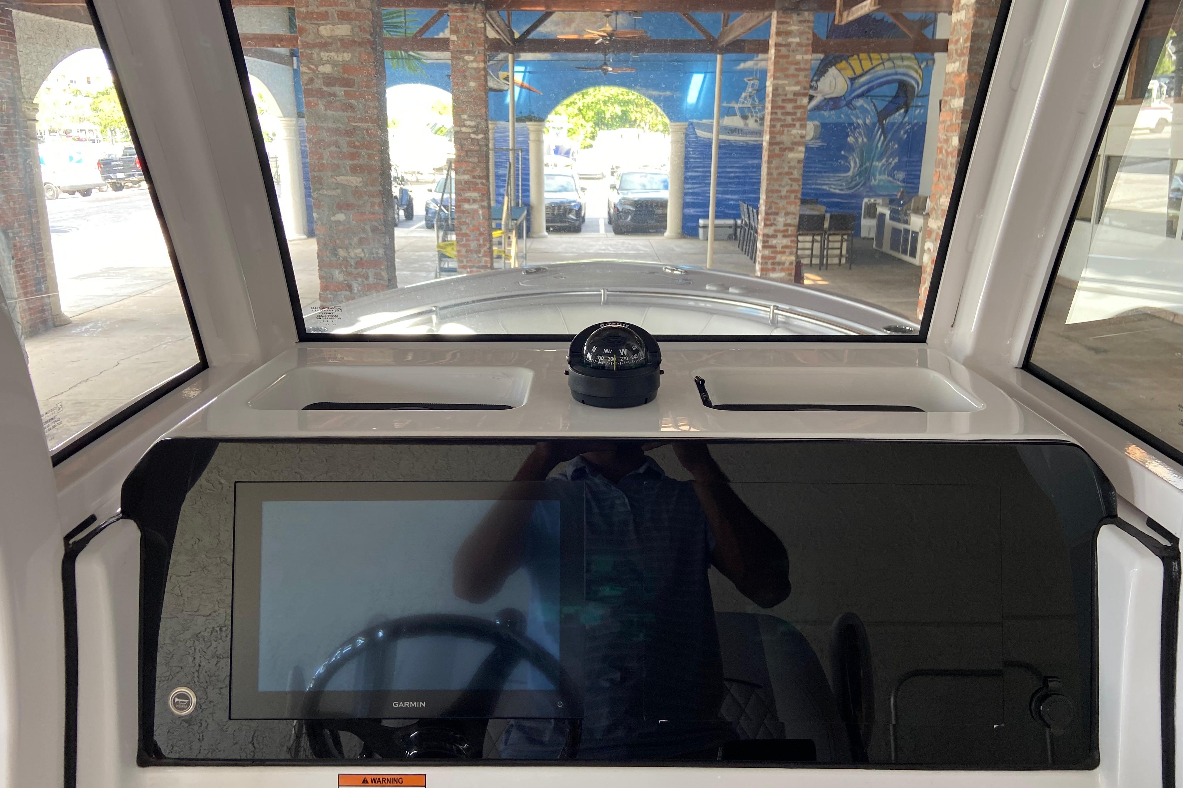 2026 Sportsman Open 232 Center Console dashboard with navigation screen and compass.
