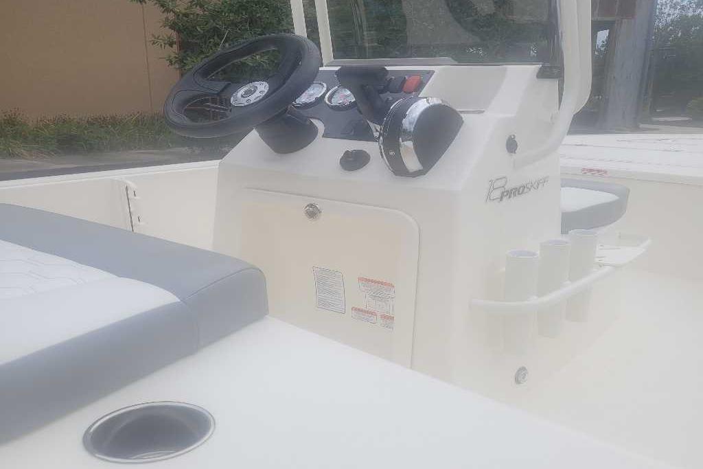 2026 Mako 18 Pro Skiff boat interior with steering console and seating.
