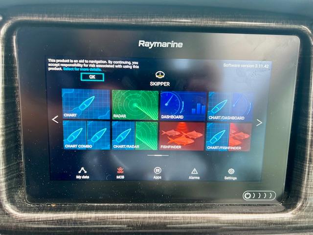 Raymarine navigation display on 2019 Monterey 295 Sport Yacht showing charts and radar options.