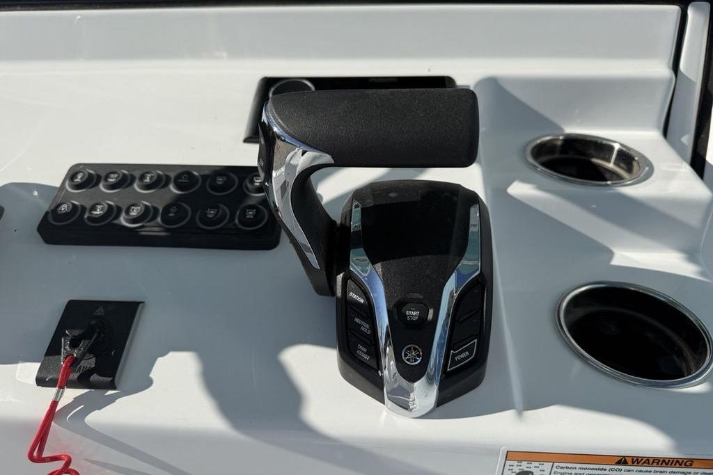 Control panel of 2026 Sportsman Masters 247OE Bay Boat with throttle and switches.