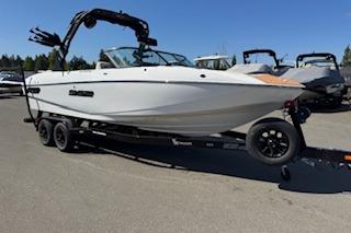2026 MB B52-23 Classic LIMITED boat on trailer, parked outdoors under clear blue sky.