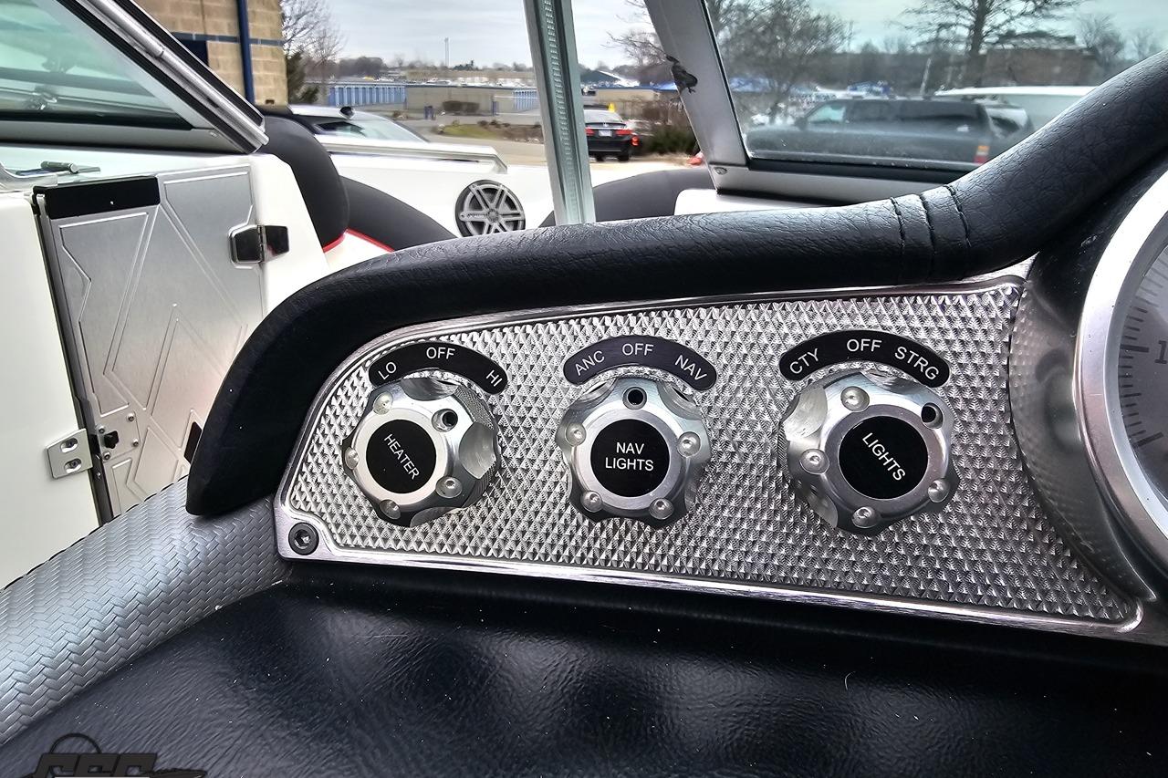Control panel of a 2013 MasterCraft X-10 boat with heater and light switches.