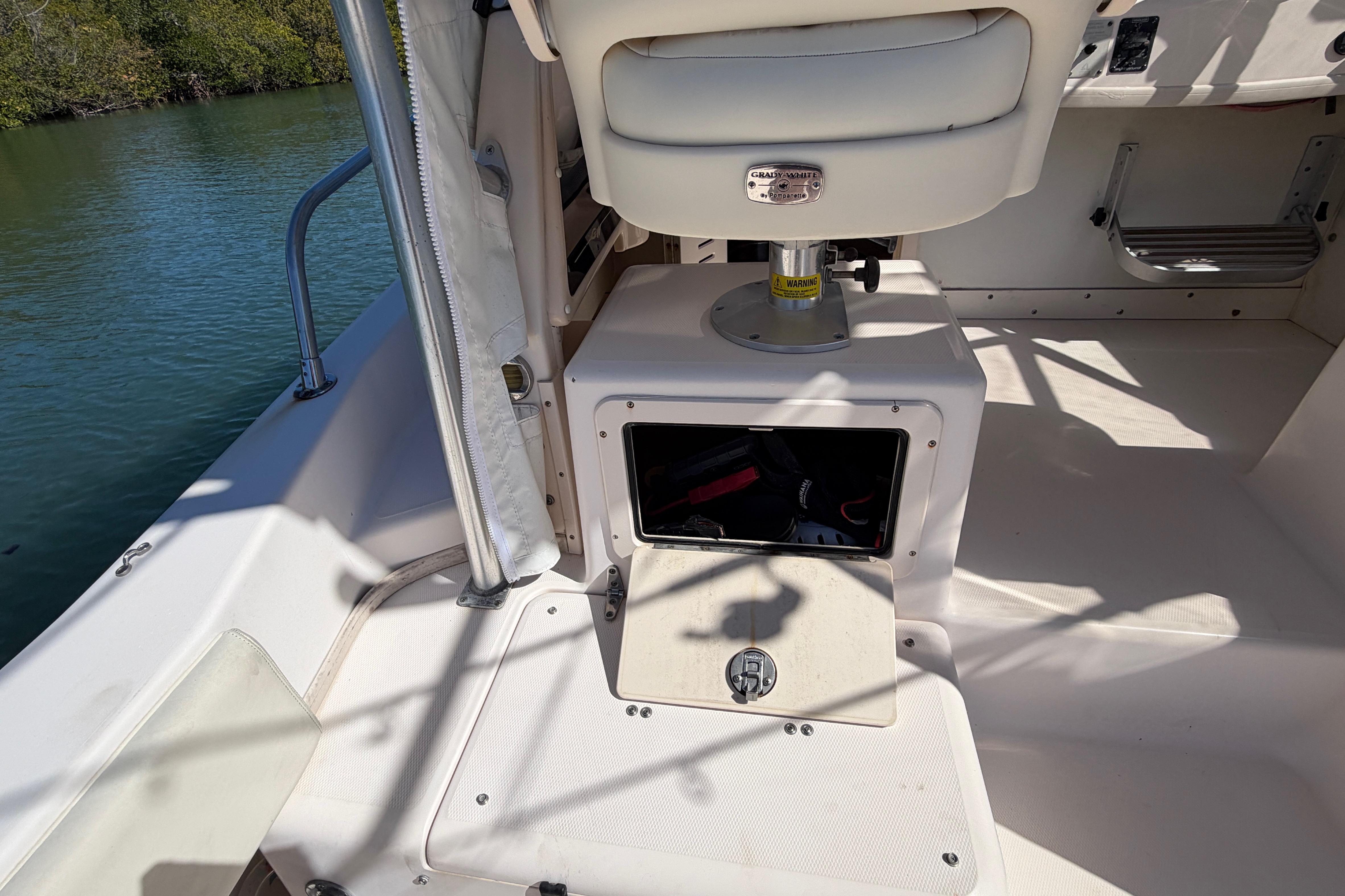 2006 Grady-White Sailfish 282 boat interior with storage compartment and seating.