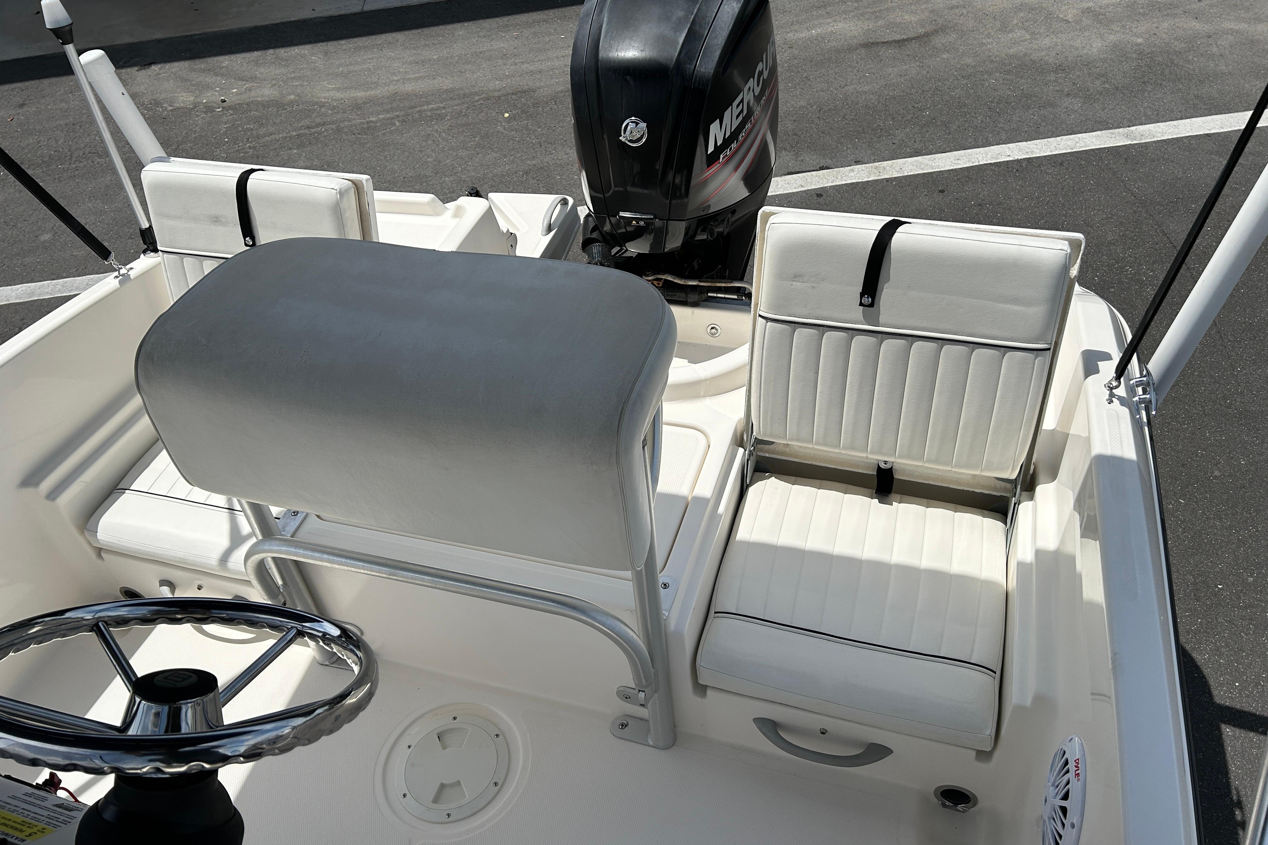 2018 Bayliner Element F16 boat interior with white seating and steering wheel.
