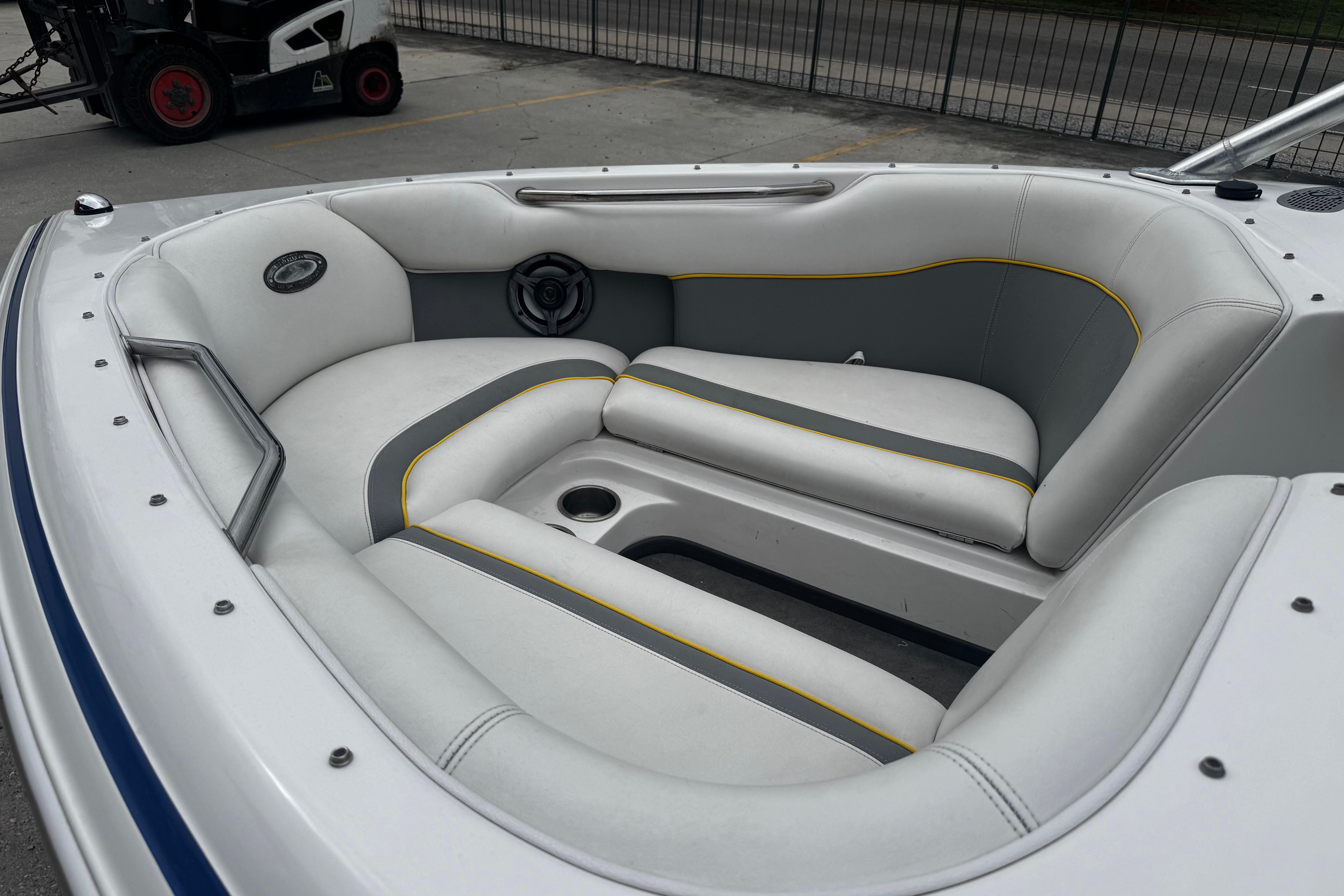 2006 Supra Launch 22 SSV boat interior with gray and white seating.