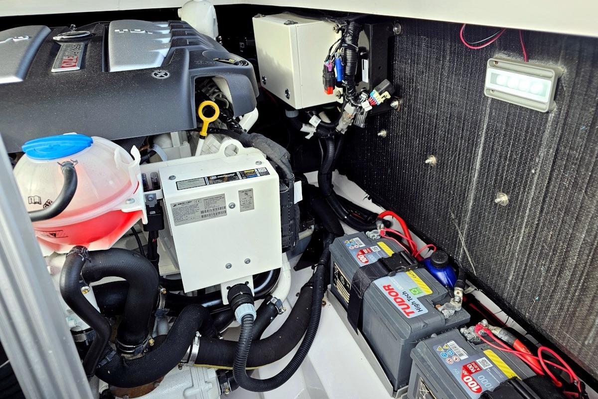 Engine compartment of 2017 Goldfish 38 Supersport with batteries and wiring.