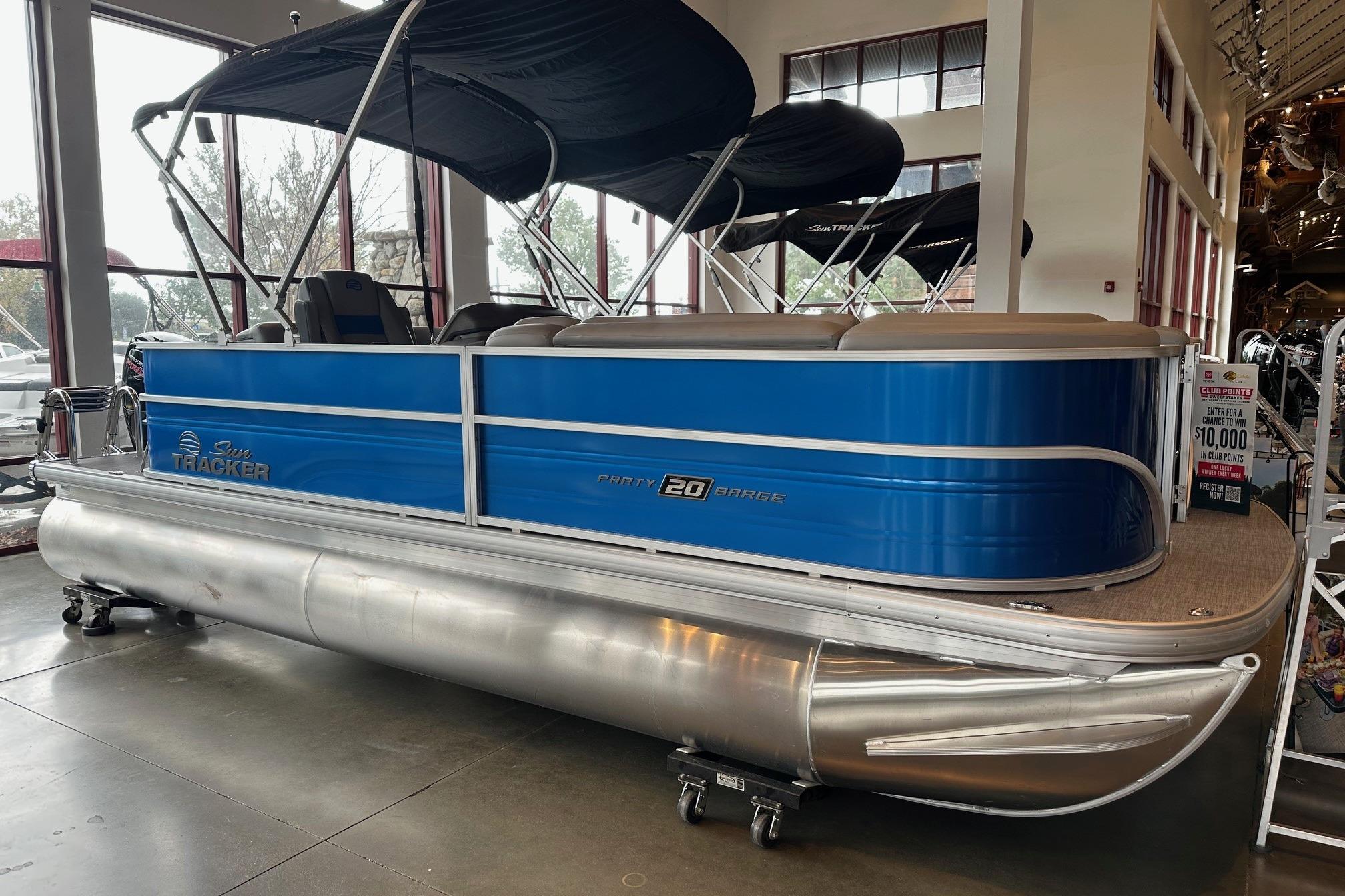 2026 Sun Tracker Party Barge 20 DLX pontoon boat displayed indoors.
