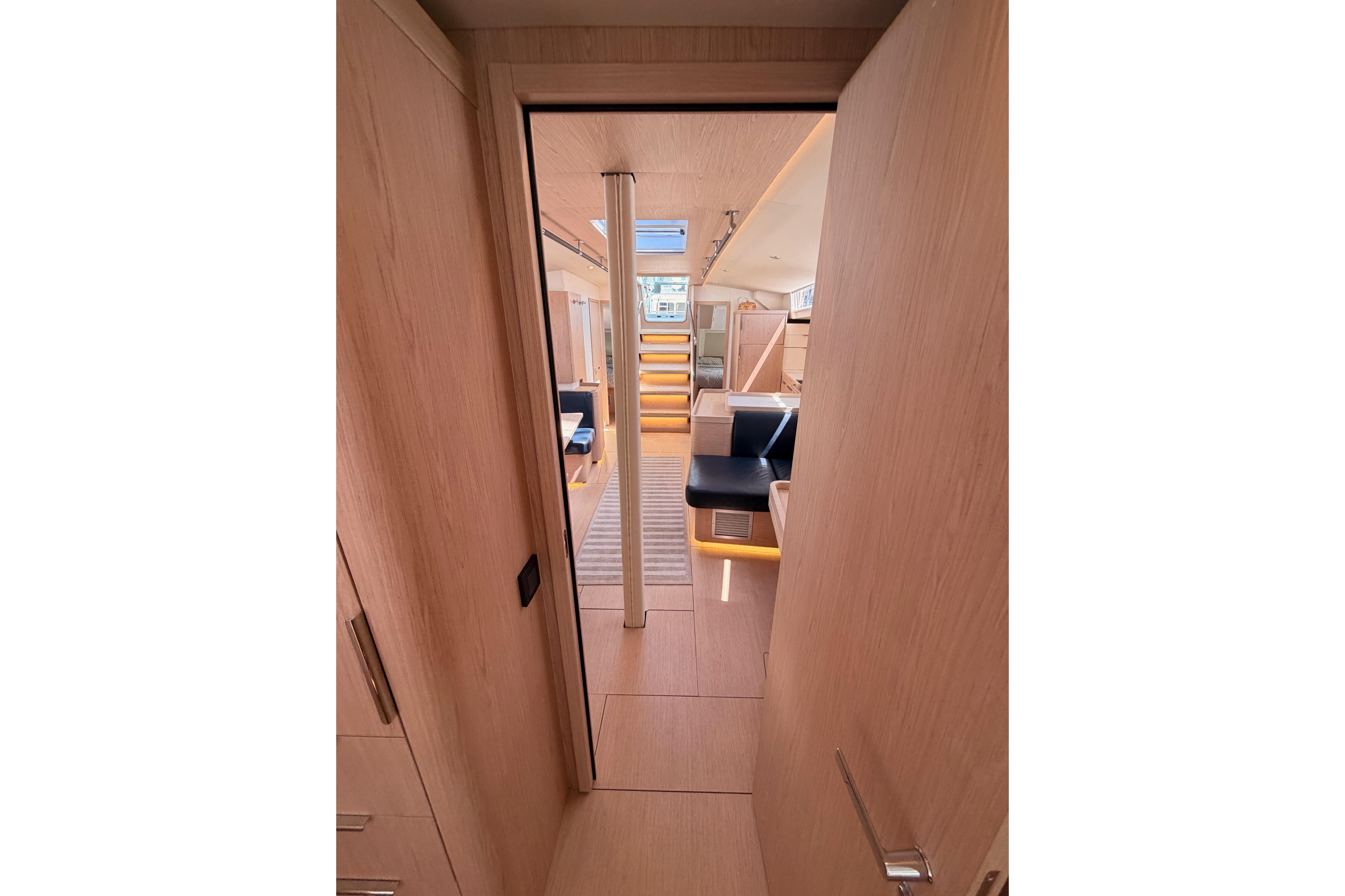 Interior view of 2022 Beneteau Oceanis Yacht 54, featuring modern design and wood finishes.