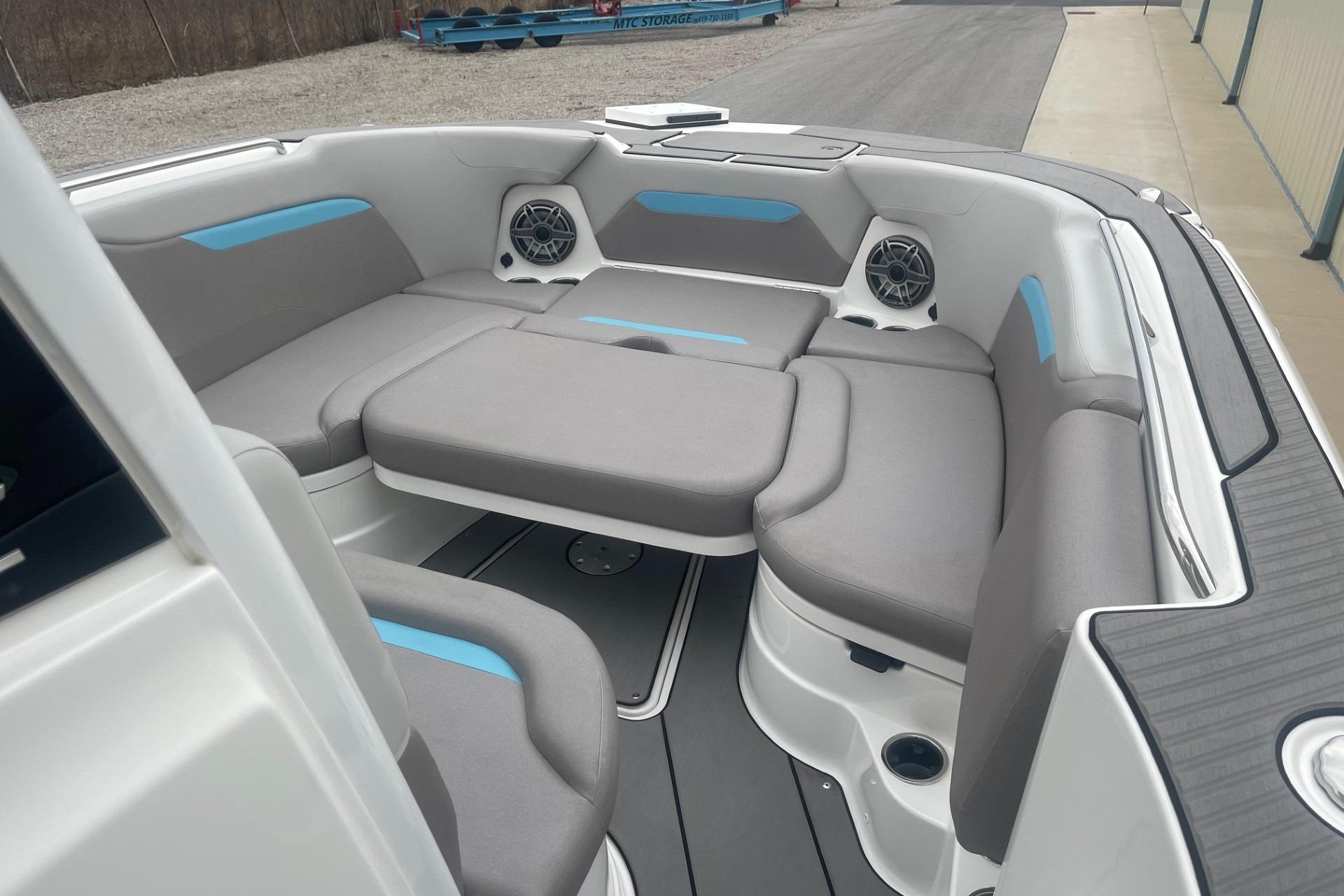 2025 Hurricane Center Console 24 OB boat interior with gray seating and blue accents.