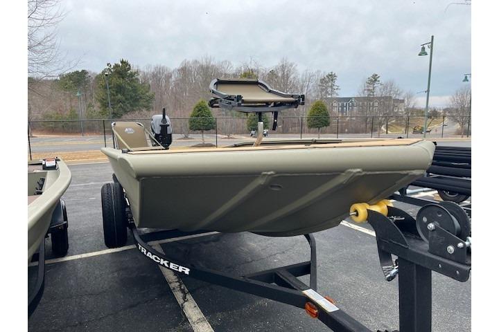 2026 Tracker Grizzly 1756 T Marsh boat on trailer in parking lot.