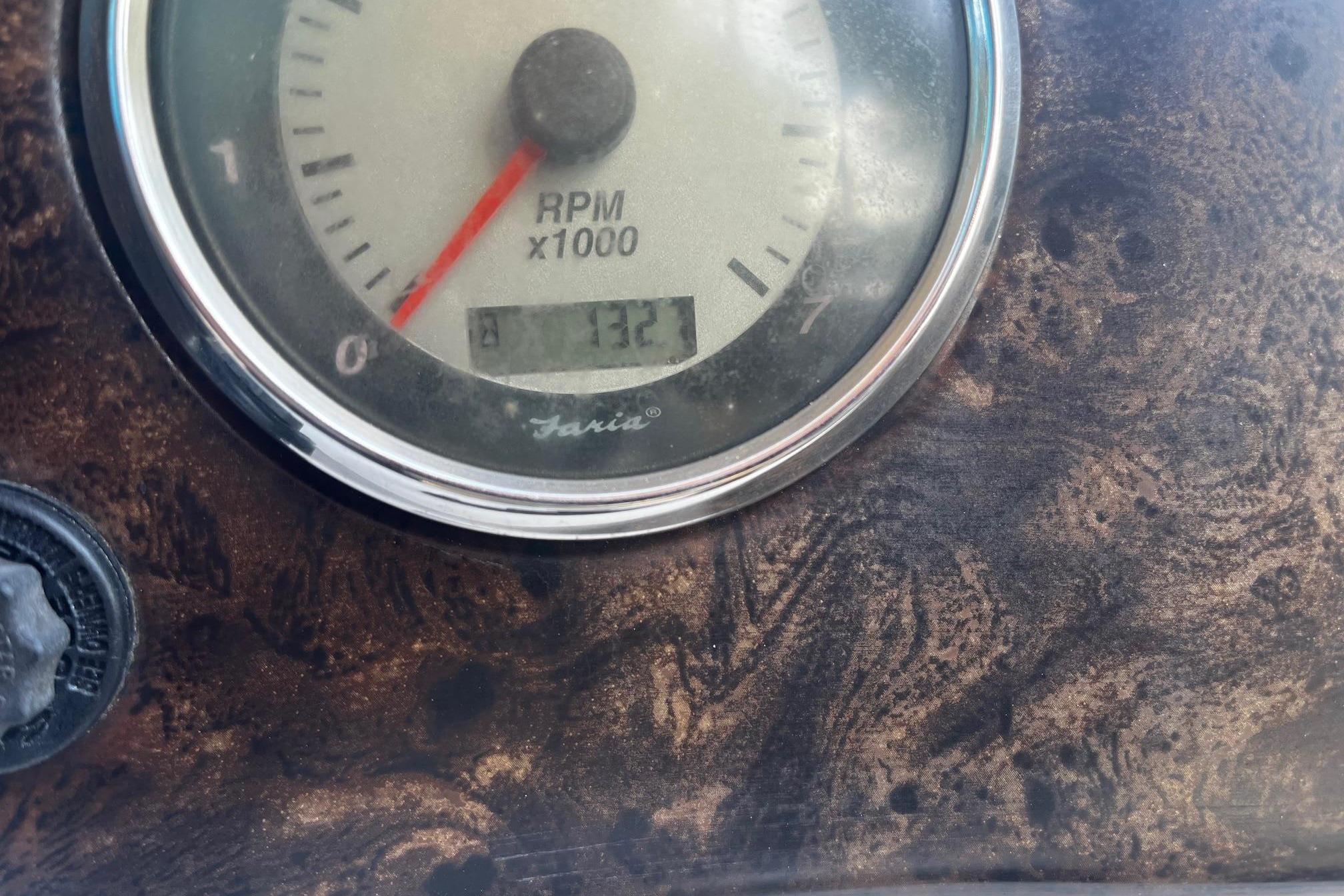 Close-up of a 2008 Hurricane FD202 RPM gauge on a textured dashboard.