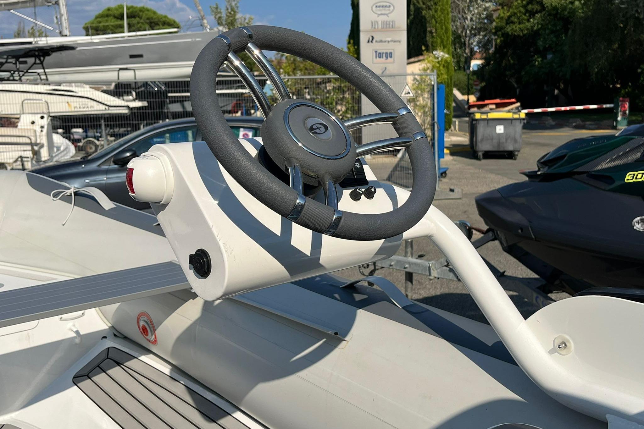 Steering wheel of 2025 Gala A360Q boat, outdoor display setting.