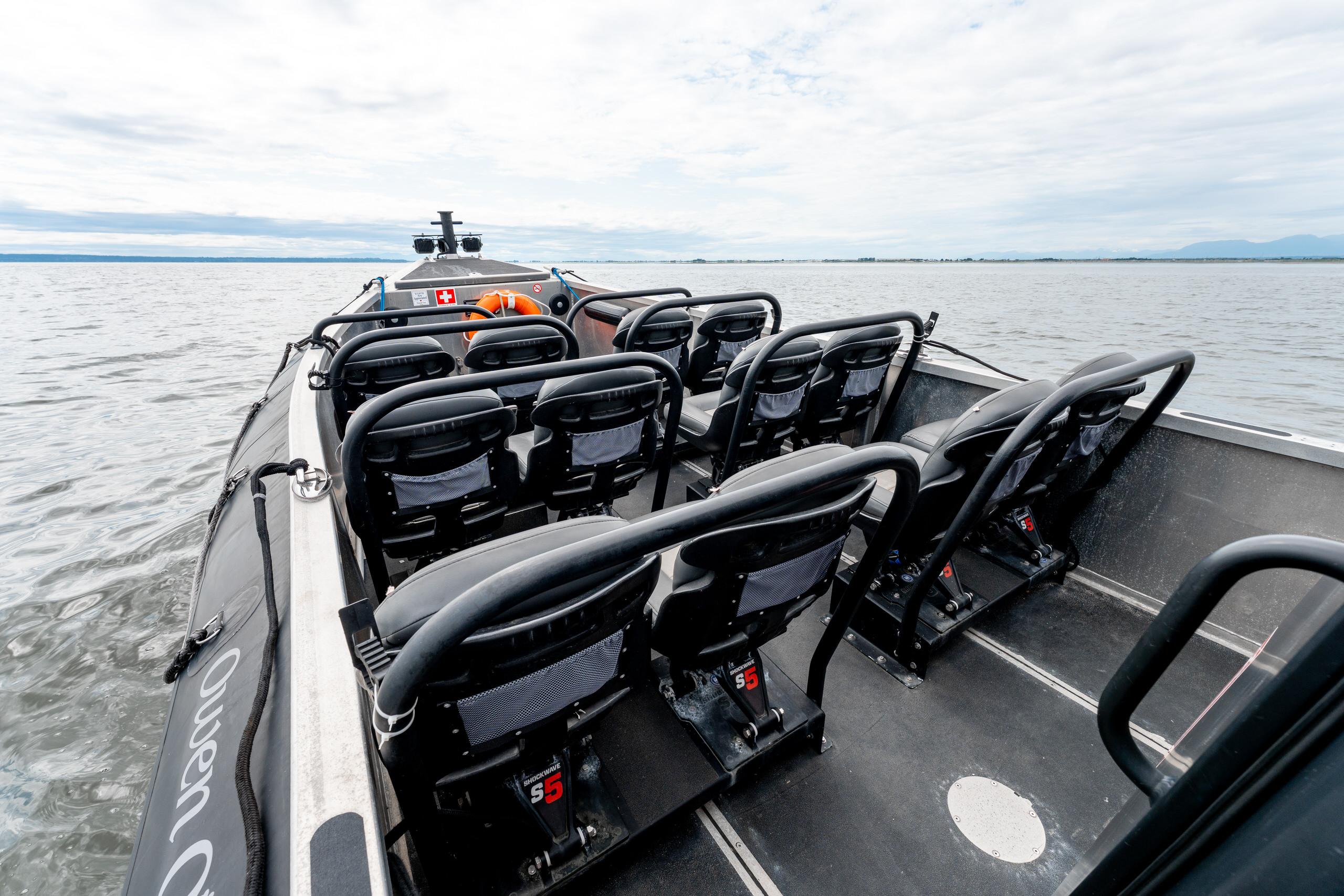 Titan D Series 8.2m Eco Tourism boat with empty seats on a calm water surface.