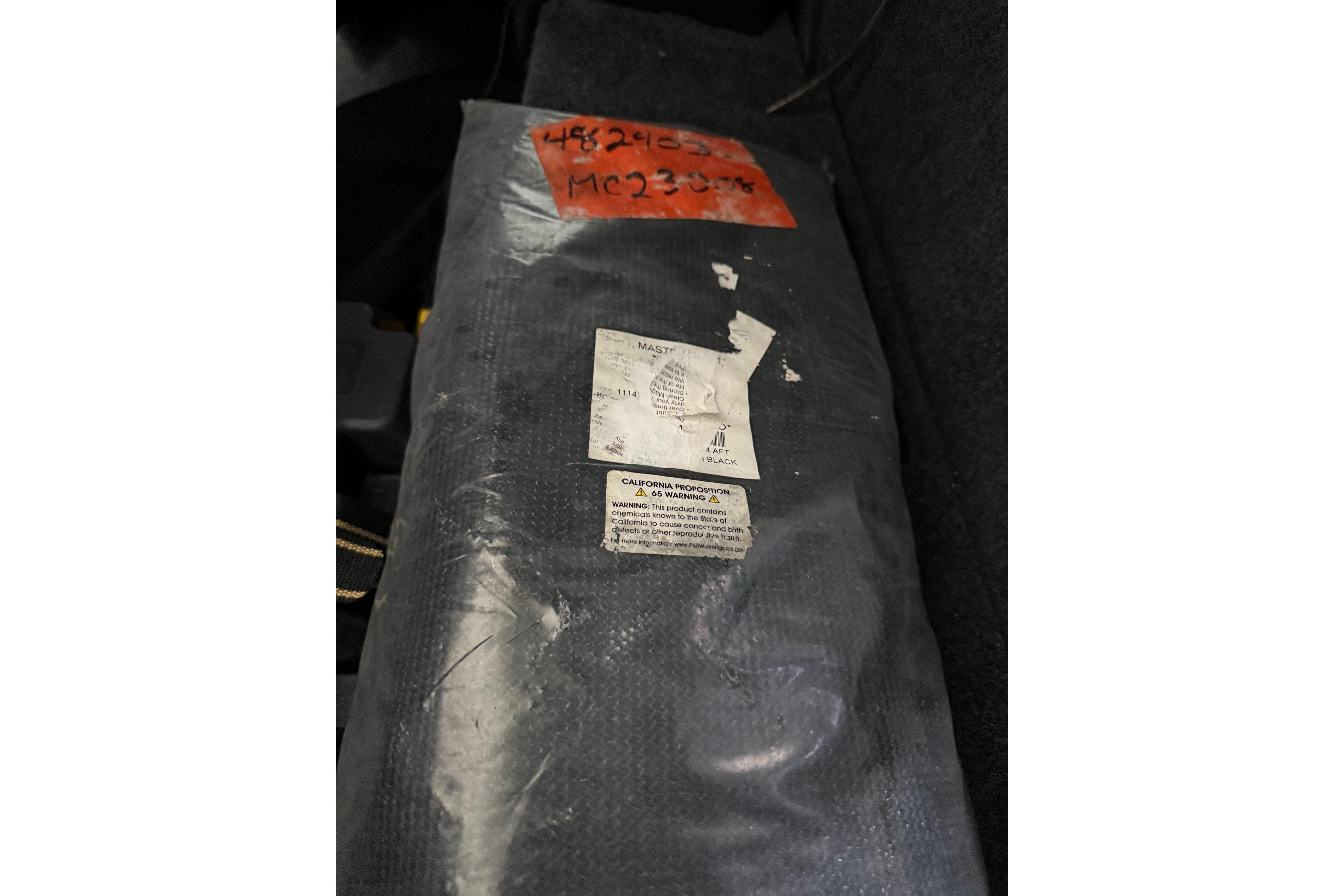 2023 MasterCraft X24 interior detail with labels and warning sticker.