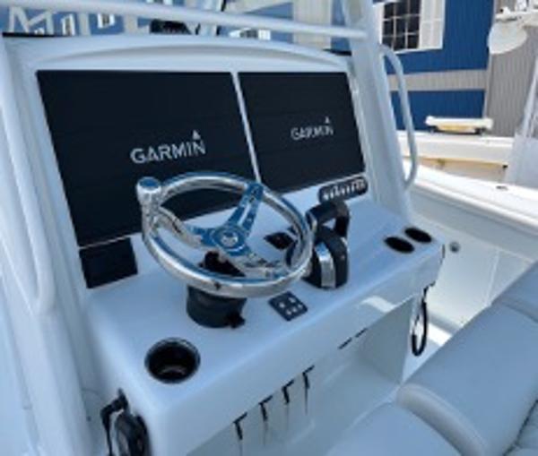 2022 Yellowfin 39 Offshore boat dashboard with Garmin displays and steering wheel.