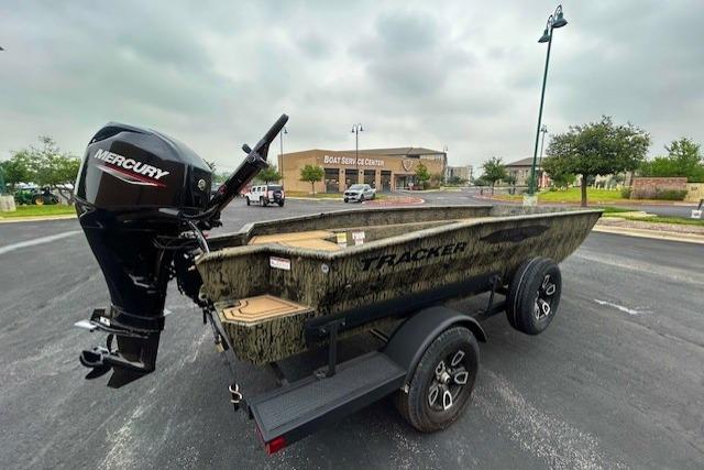 2026 Tracker Grizzly 1650 T Prairie Wings Edition boat with Mercury engine on trailer.