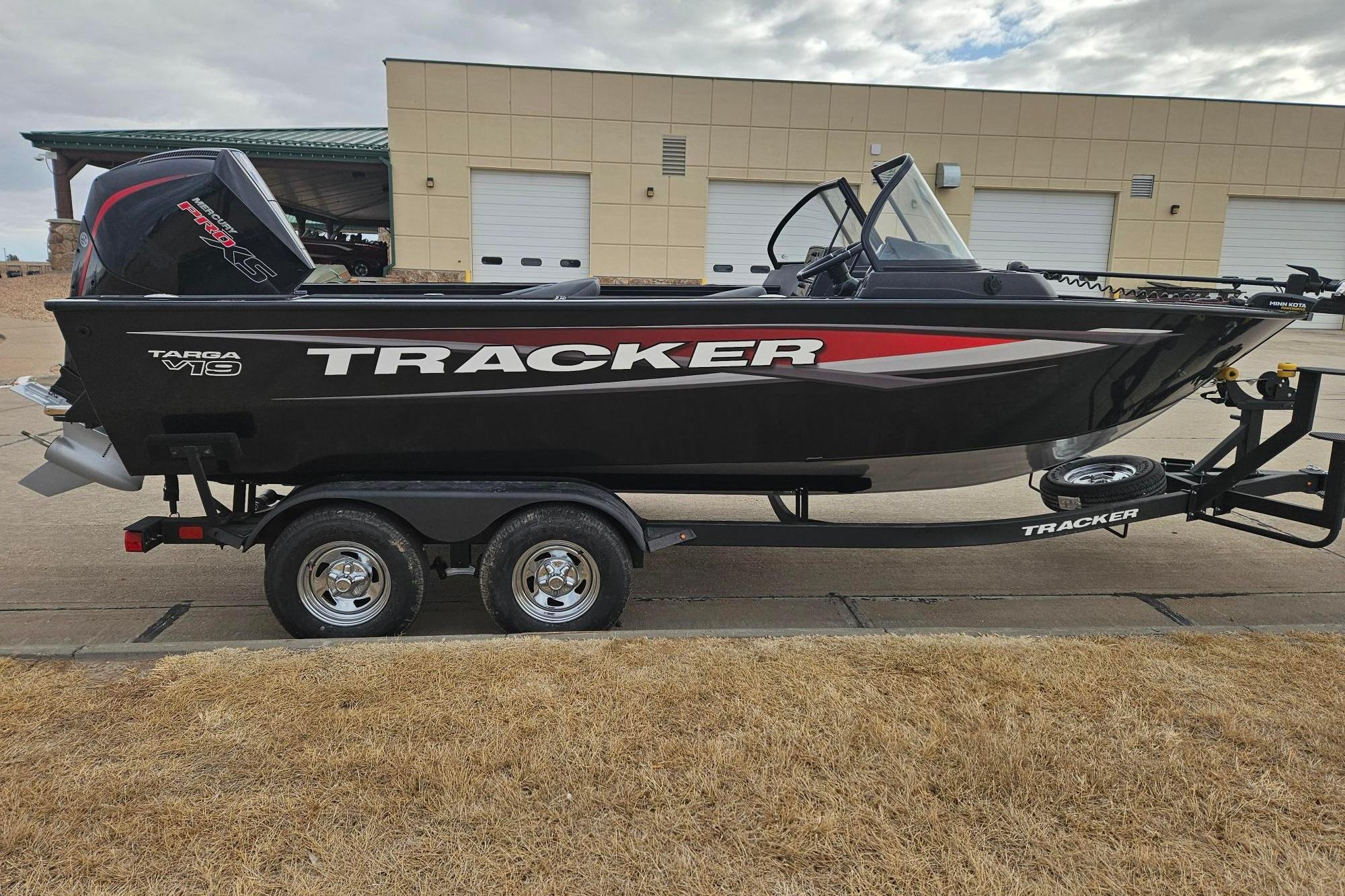 2026 Tracker Targa V-19 WT boat on trailer, parked outdoors.