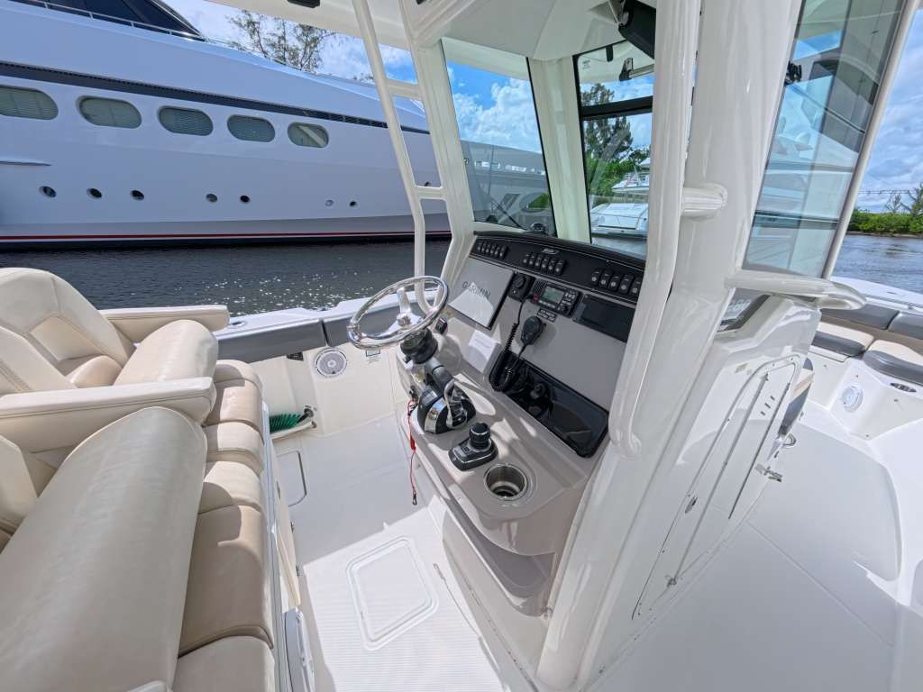 Interior of a 2017 Boston Whaler 280 Outrage boat, helm station and seating.