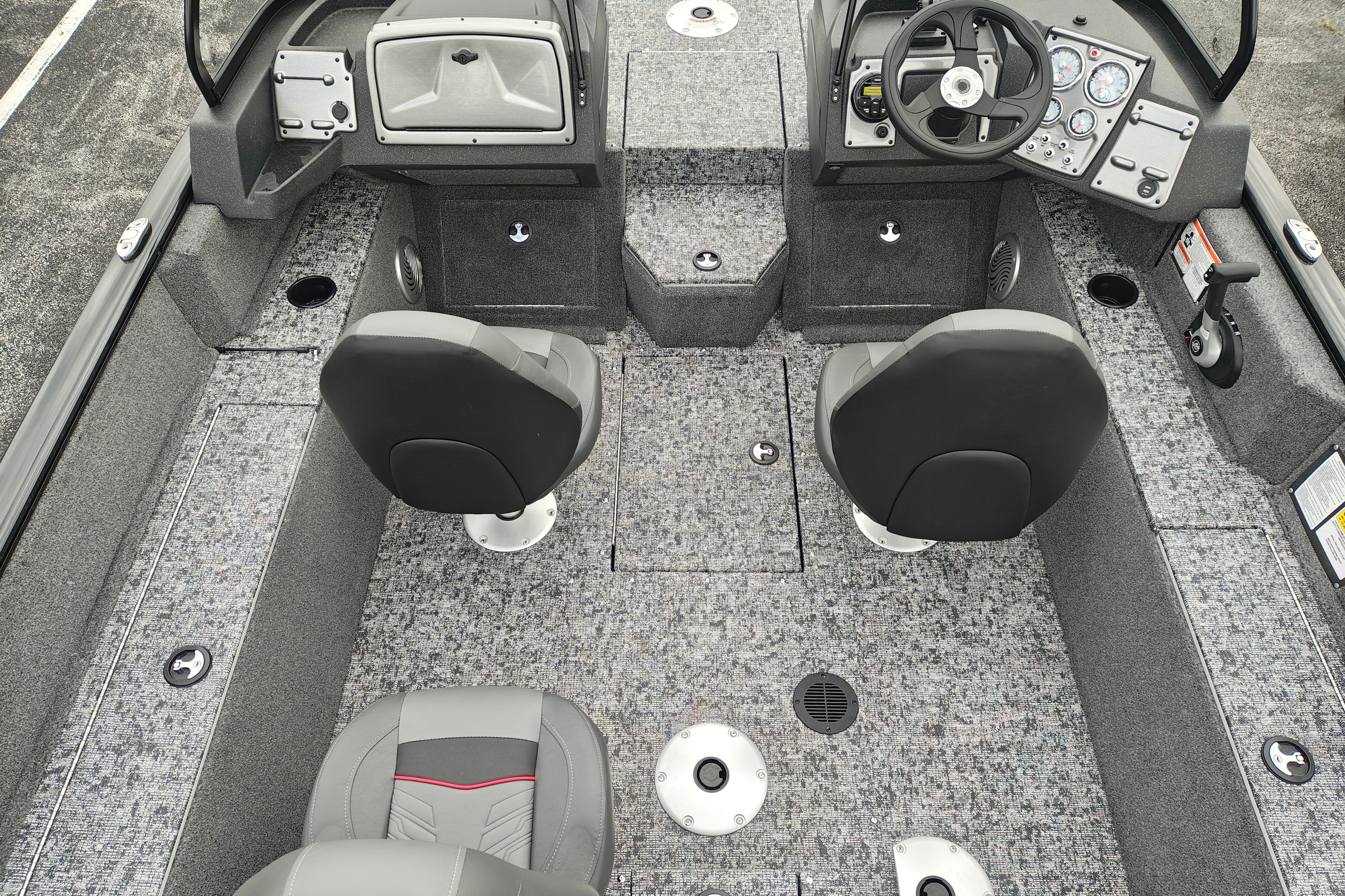 2026 Tracker Pro Guide V-175 WT boat interior with gray seating and dashboard controls.