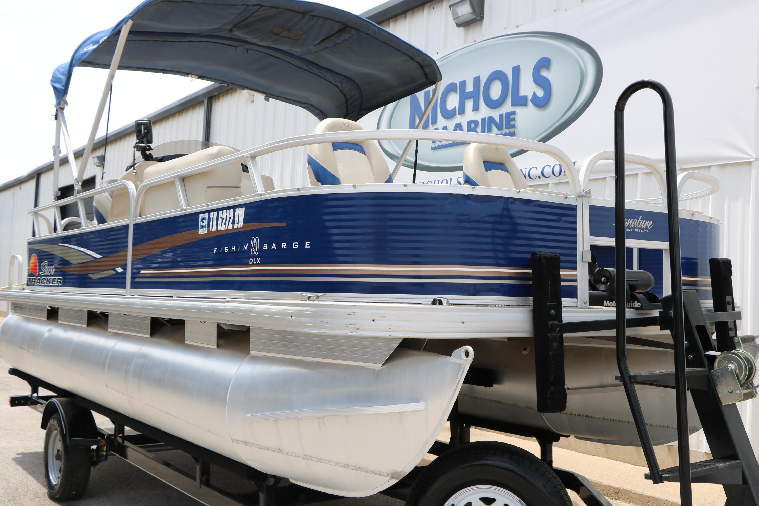 2013 Sun Tracker Fishin' Barge 20 DLX pontoon boat on trailer at Nichols Marine.