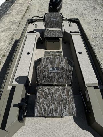 2024 SeaArk 31652 CRAPPIE boat with camouflage seating and spacious interior design.