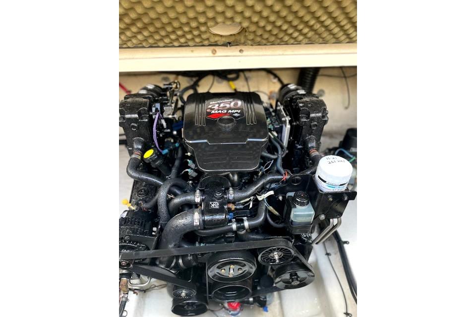 Engine of a 2004 Sea Ray 240 Sundancer boat, featuring a 350 MAG MPI.