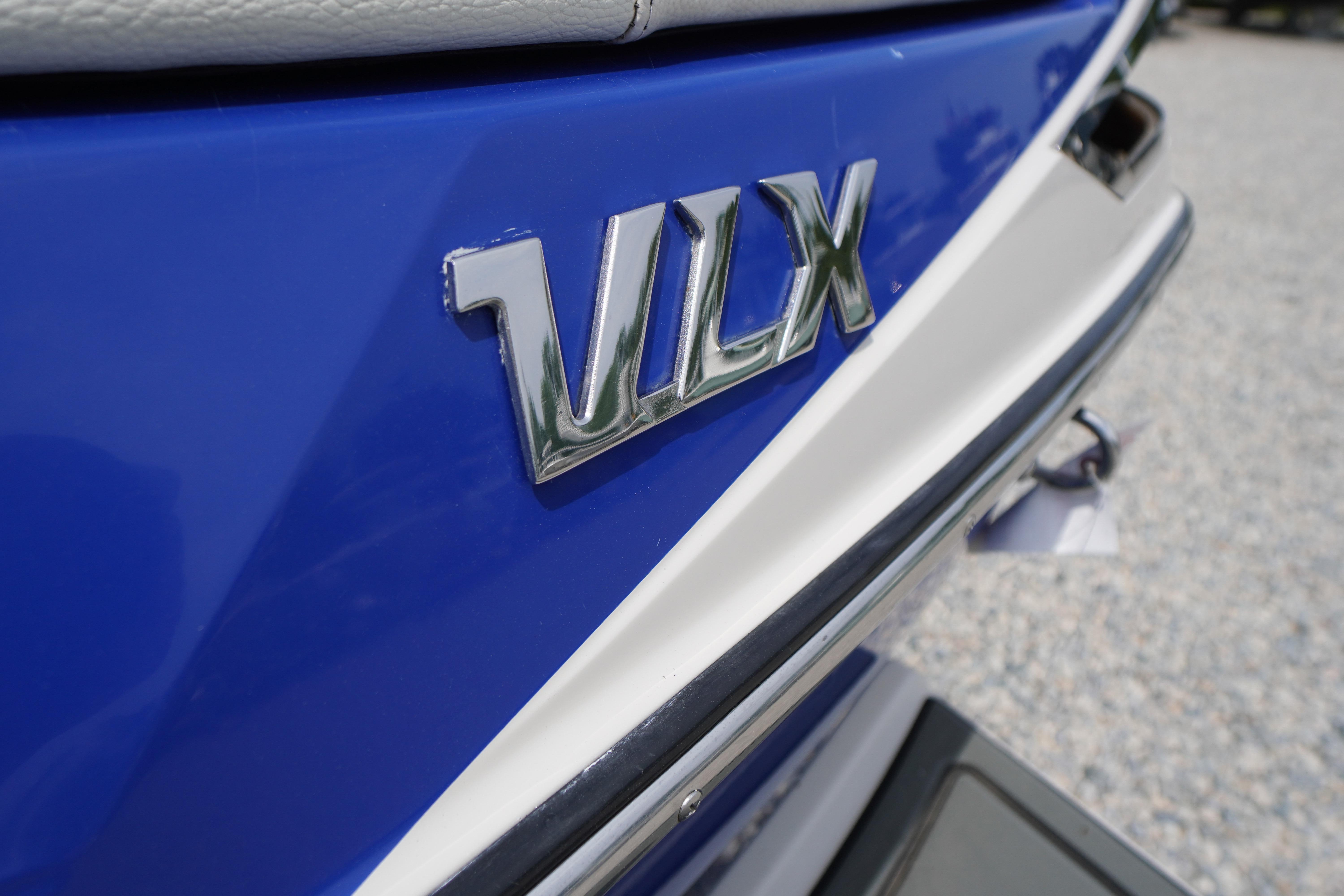 2011 Malibu Wakesetter 21 VLX boat emblem on blue hull.