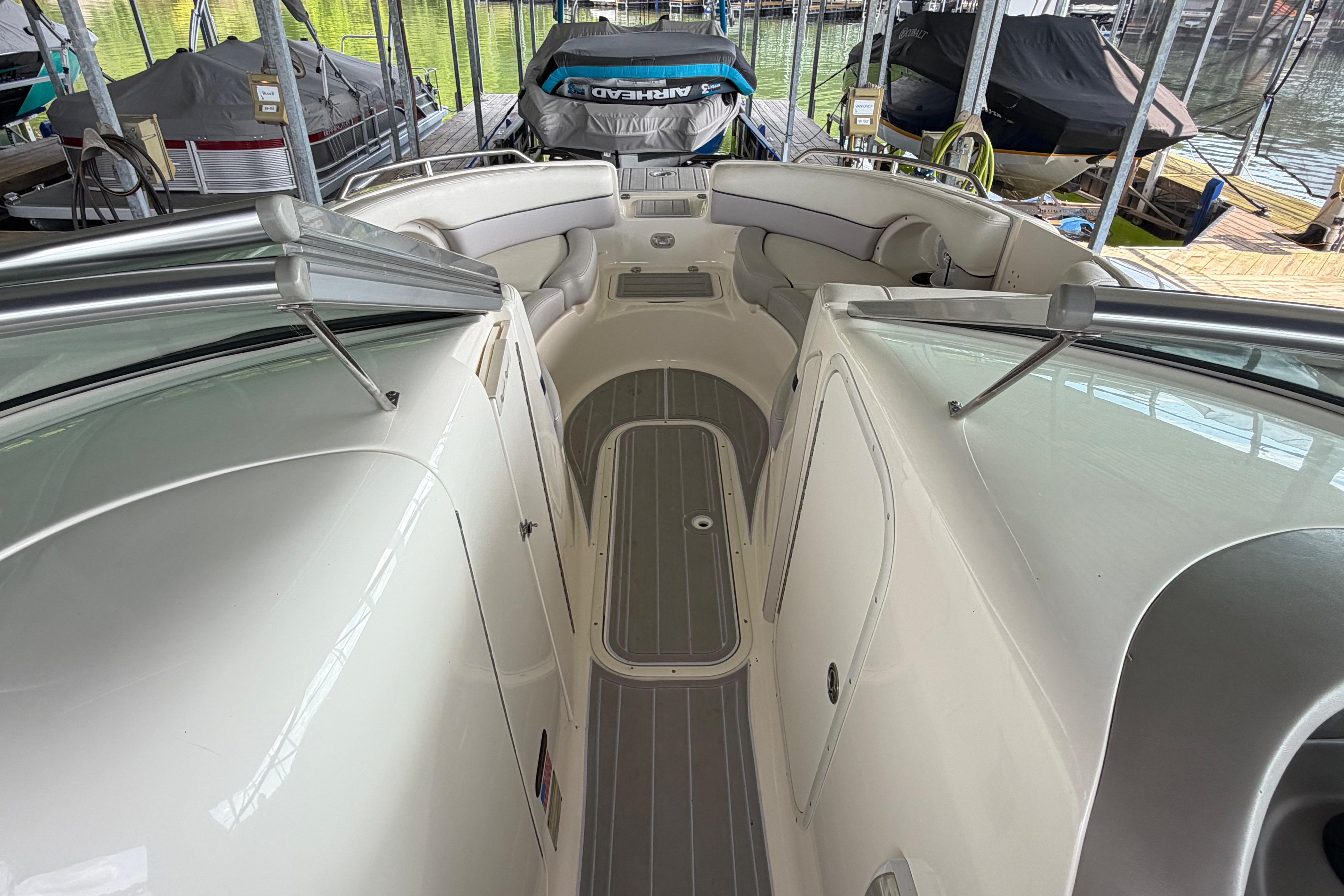 Interior view of a 2010 Bryant 255 boat docked in a marina.