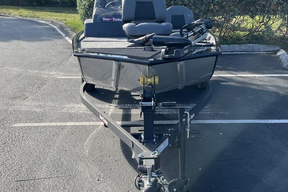2026 Tracker Bass Tracker Classic XL boat on trailer in parking lot.