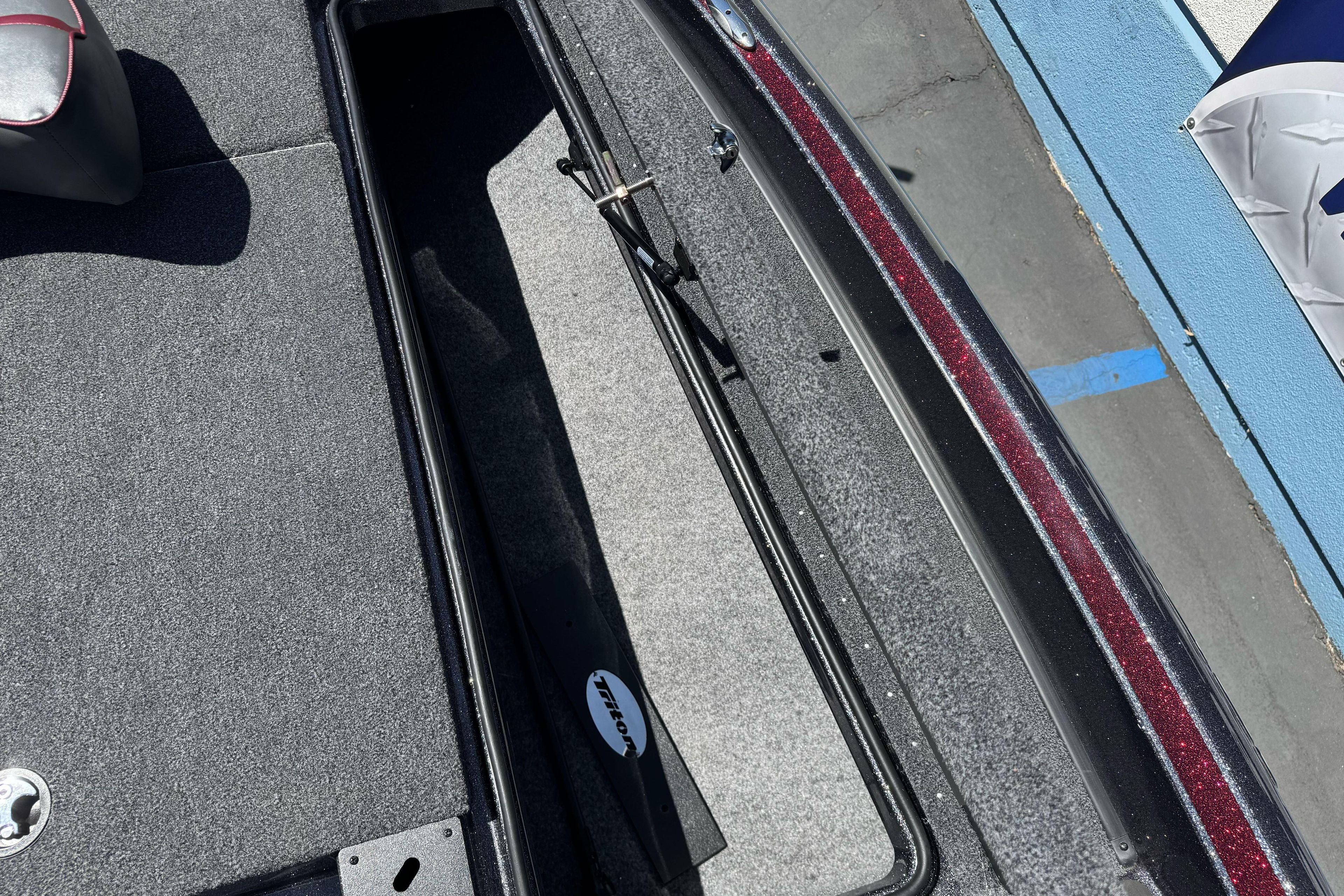 Interior view of a 2026 Triton 18 TrX boat storage compartment.
