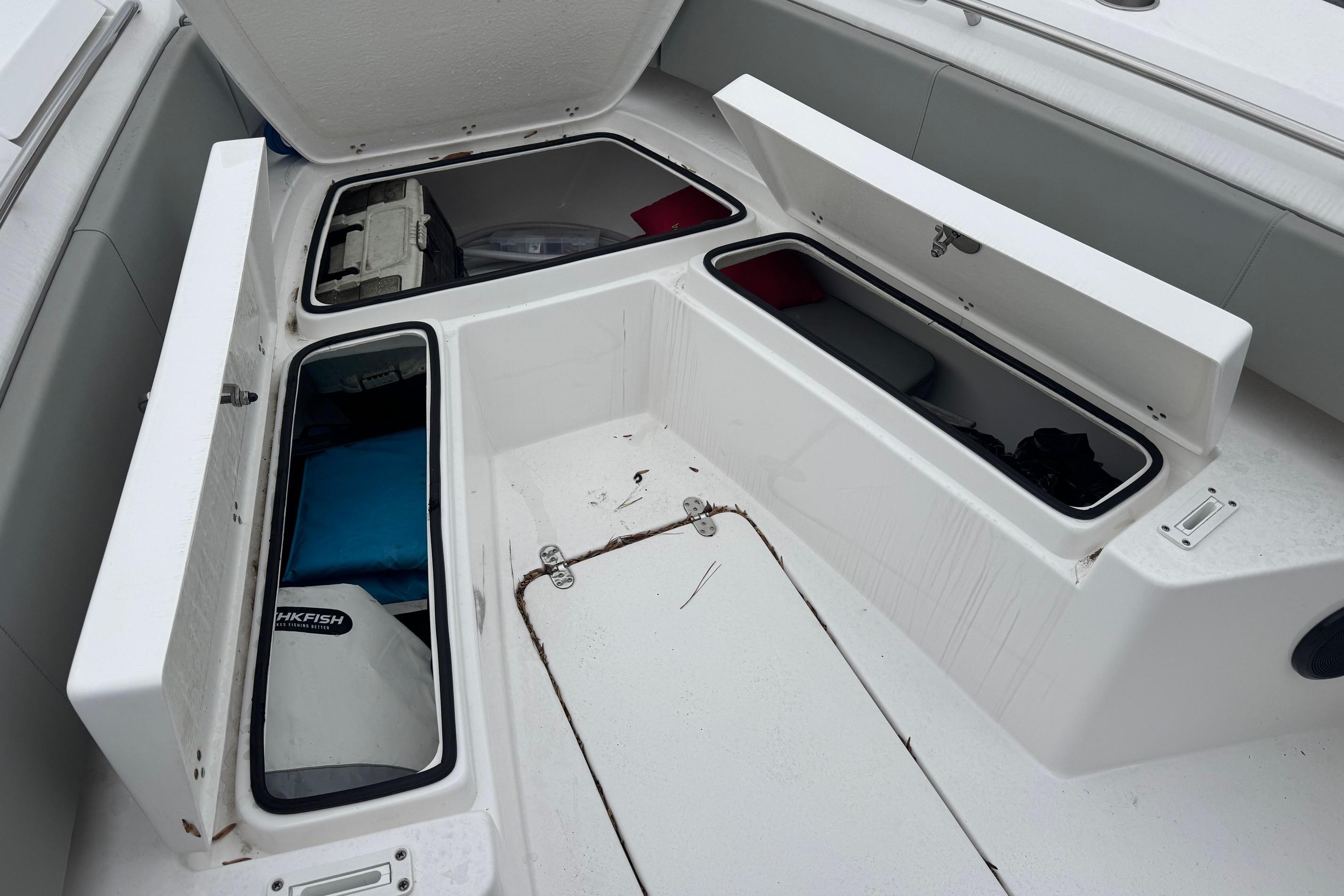 2024 Cape Horn 32 XS boat storage compartments open, showcasing interior space.